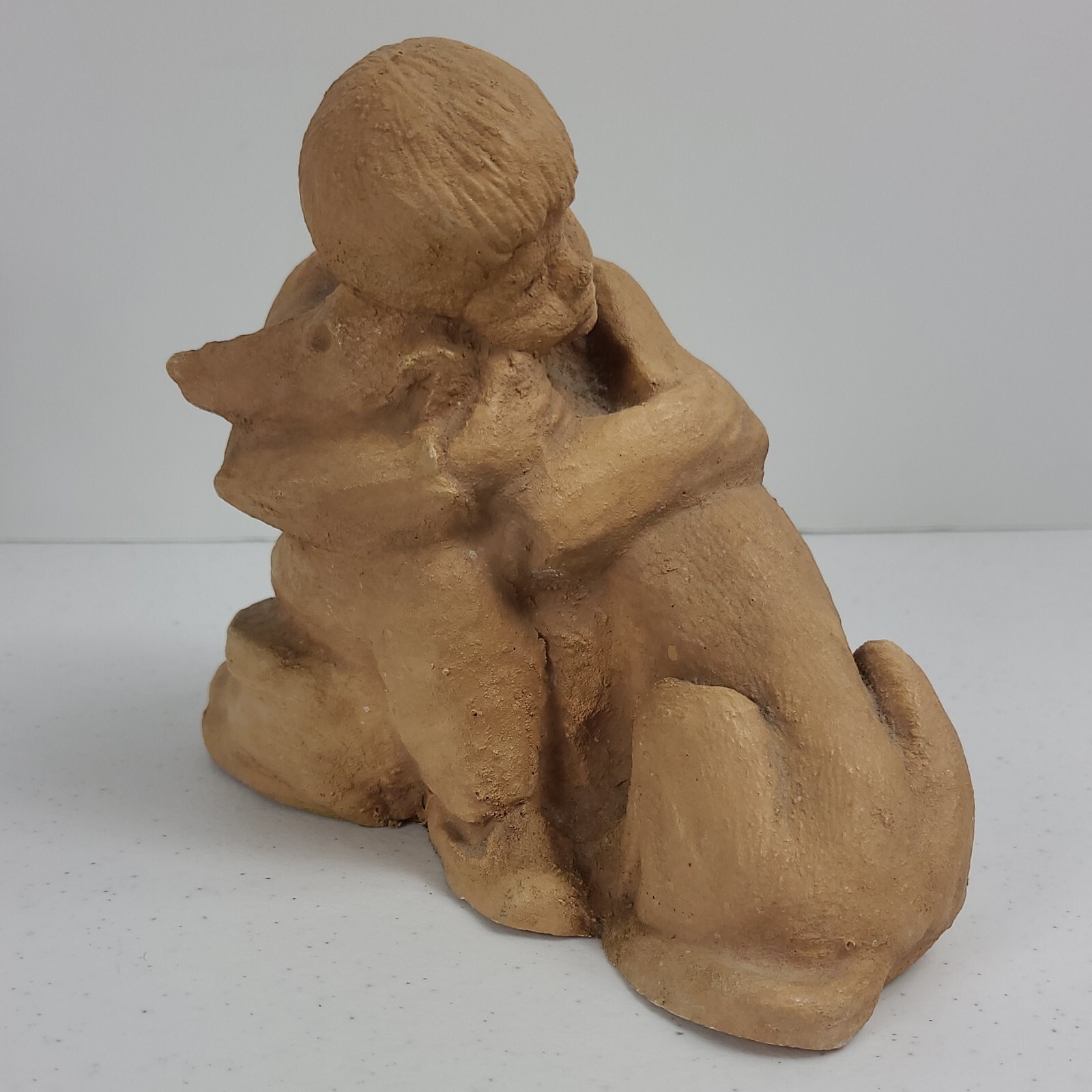 Boy and His Dog Figurine Approx. 5 3/4”H x 7″L Resin ? Painted Matte Sand Finish