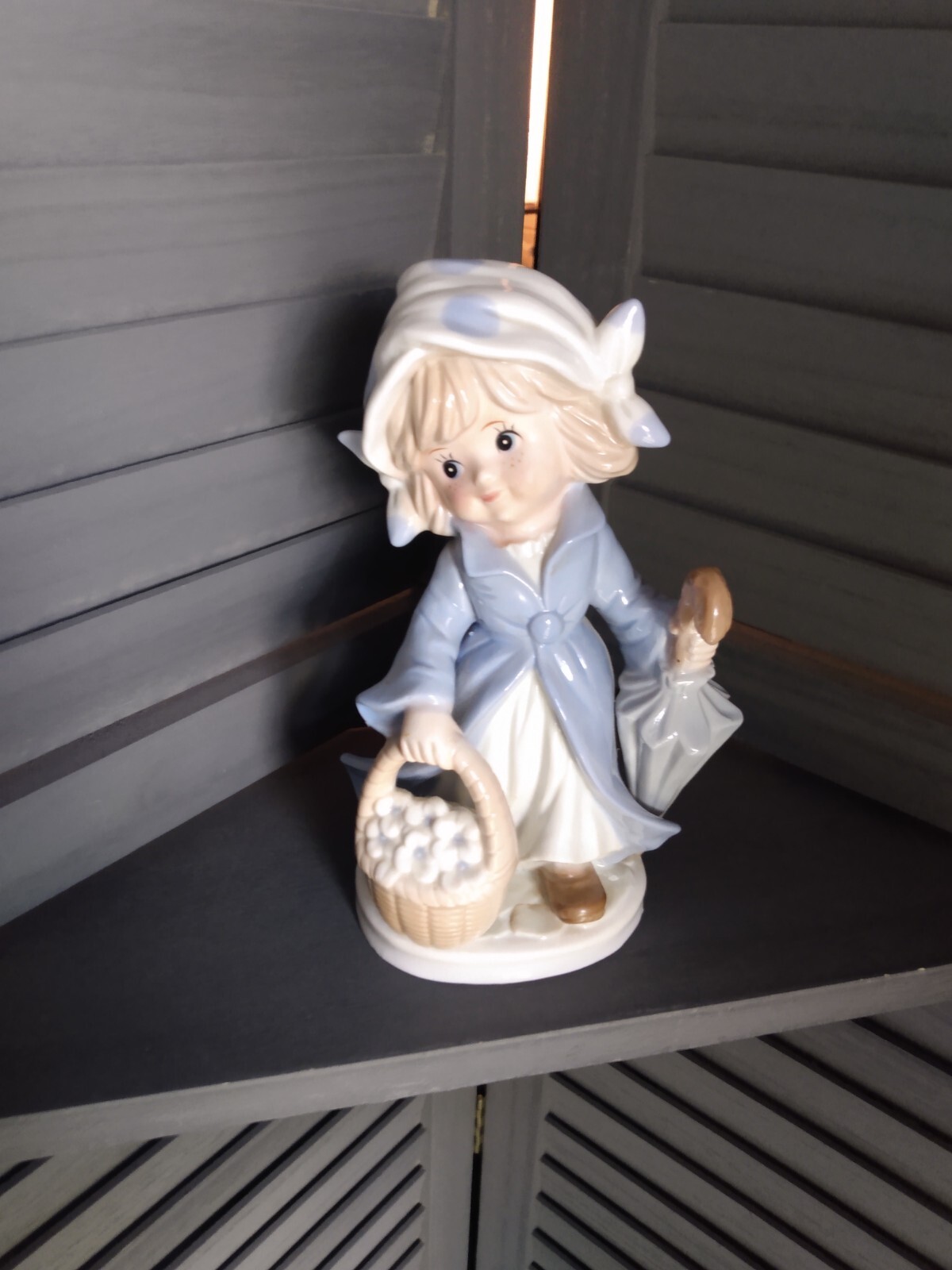 Vintage KMP porcelain girl figurine 7 7/8 inch with umbrella and basket.