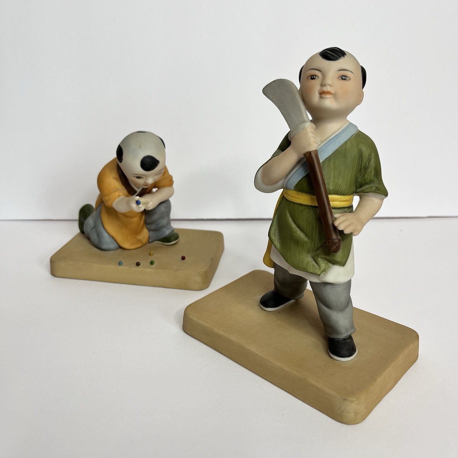 Lin Porcelain Playing Marbles And Sword Play Limited Editions Figurines