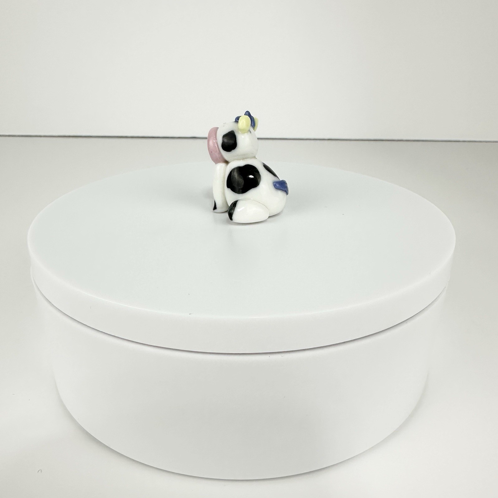 Vintage Mini Black And White Cow Figurine Sitting