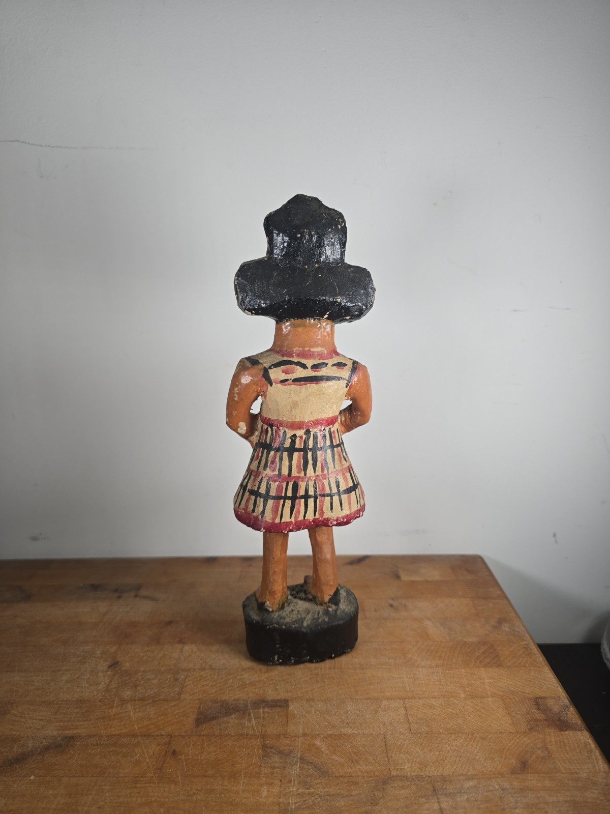 Folk art carved wood figure masked