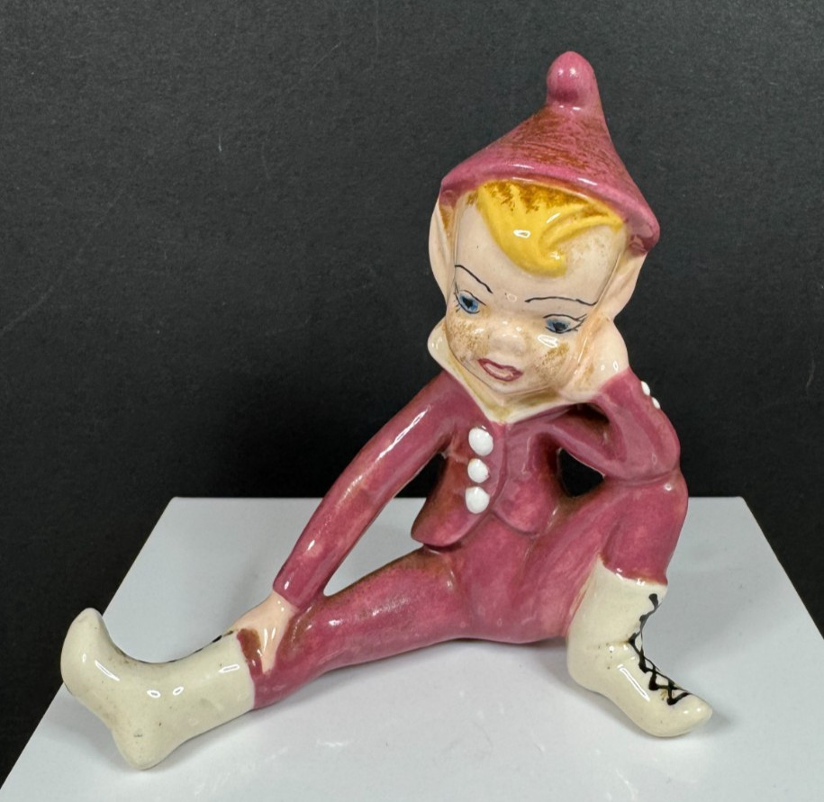 Vintage Pixie Elf Contemplating Wearing Burgundy Outfit Porcelain Figurine