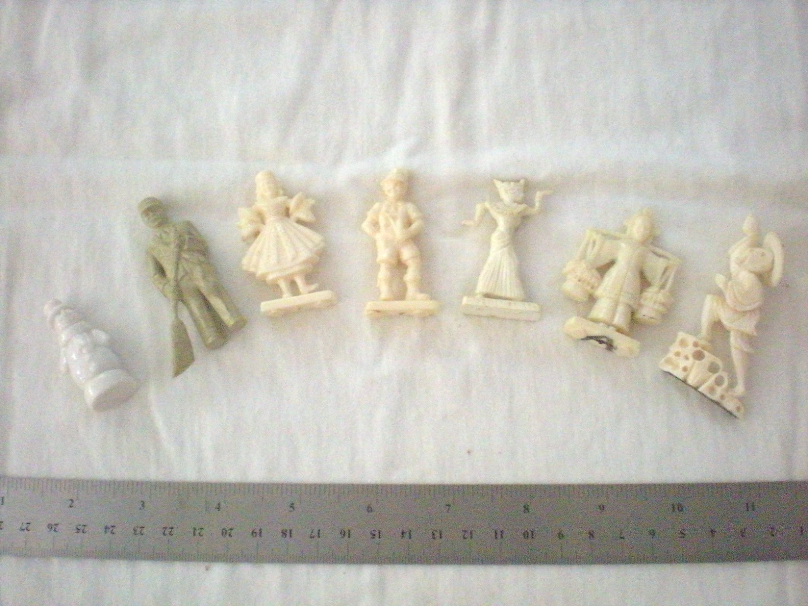 Lot of 7 Miscellaneous Ivory Colored, Molded Plastic Figurines