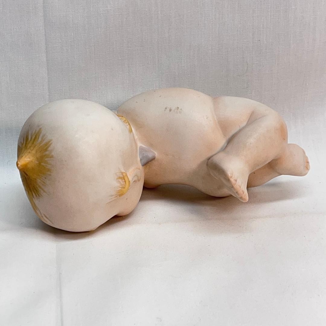 VINTAGE Porcelain Kewpie Winking Doll Figurine 2 in W x 5 in L x 3 1/2 in H