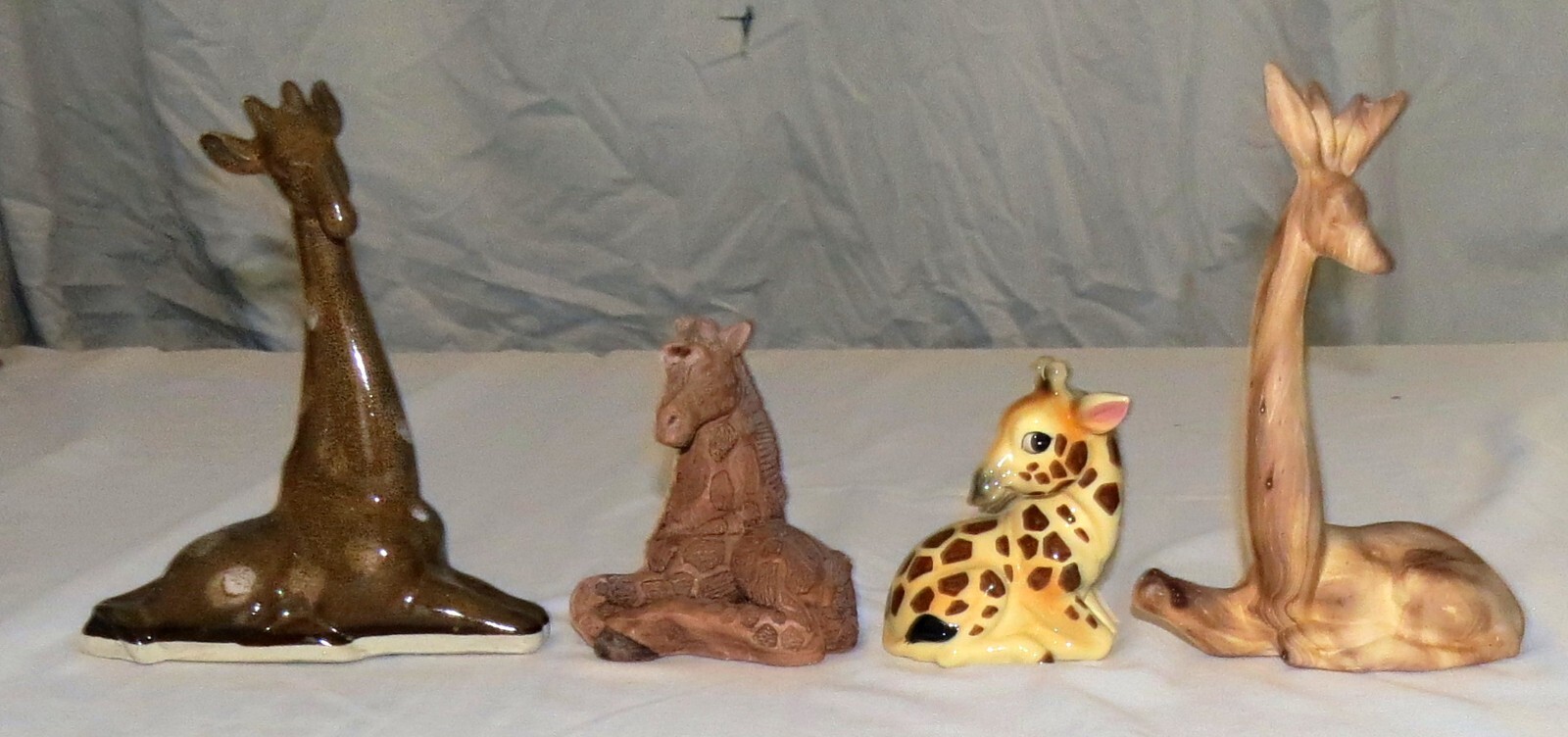 Four Ceramic Giraffes 4 inches to 7.1/2 inches