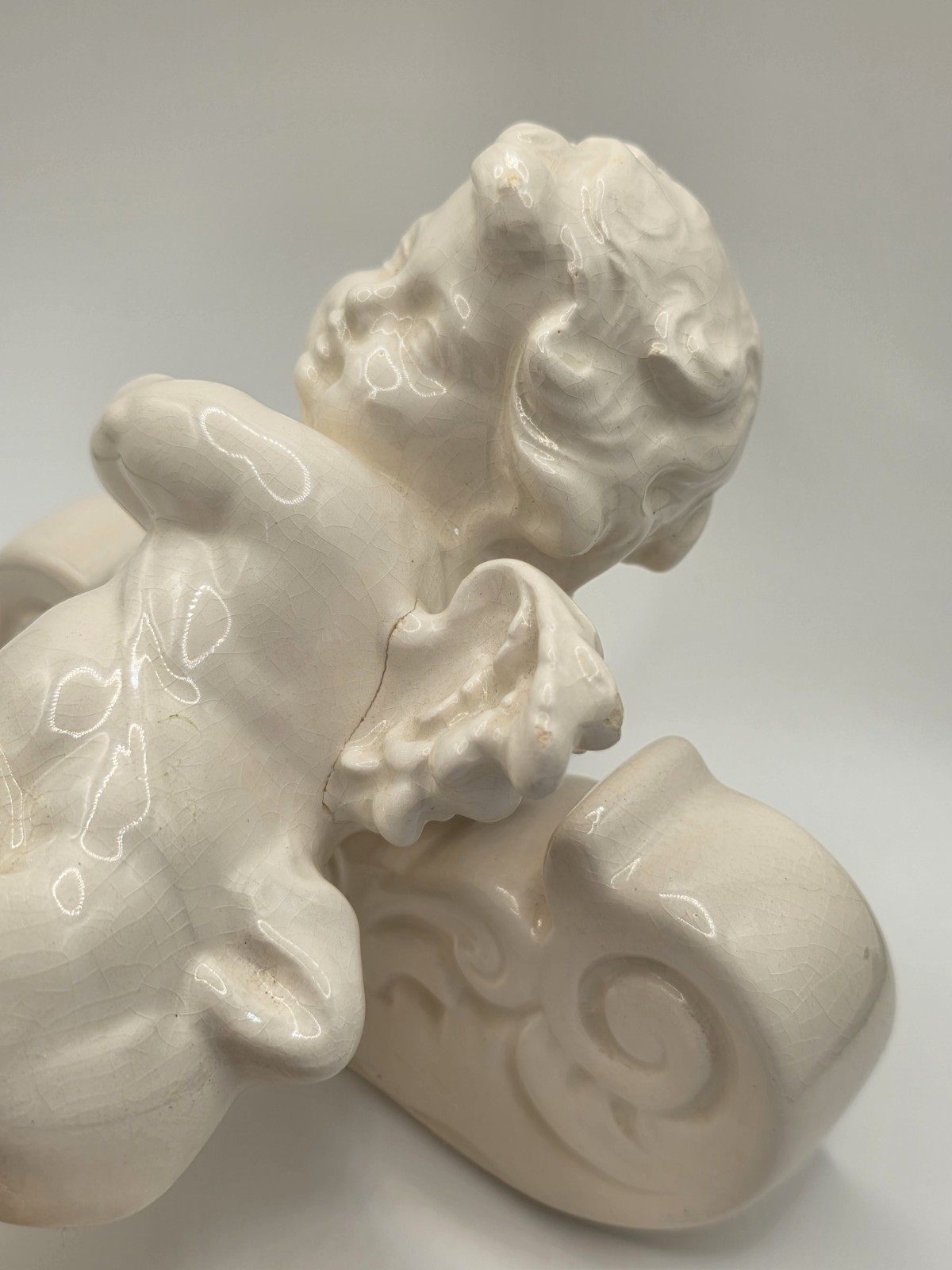 Vintage Ceramic Cherub Angel Figurine Reclining on Scroll Base – Cracks/Read