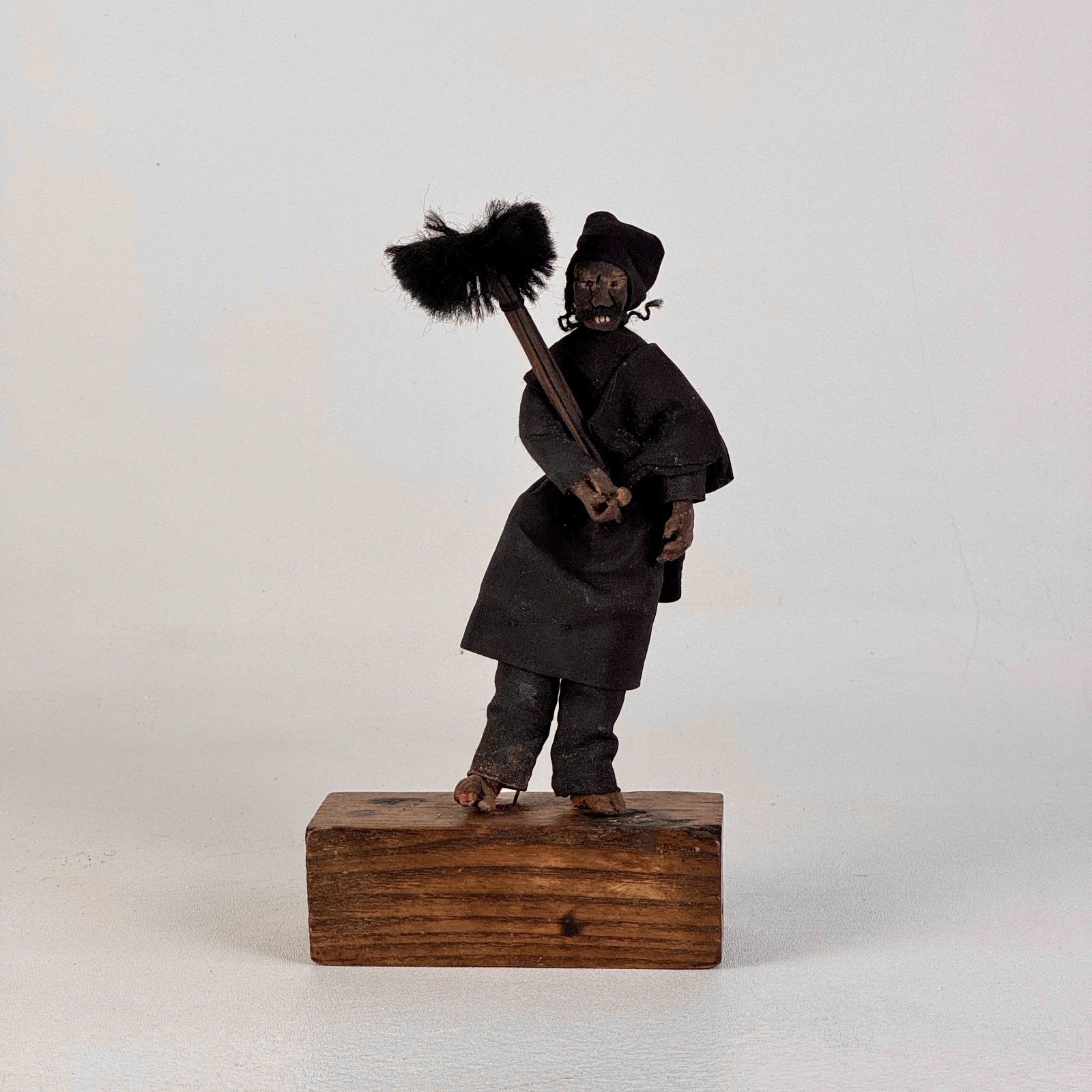 Early 20th Century Primitive “the Chimney Sweeper” Clay Figure on Stand