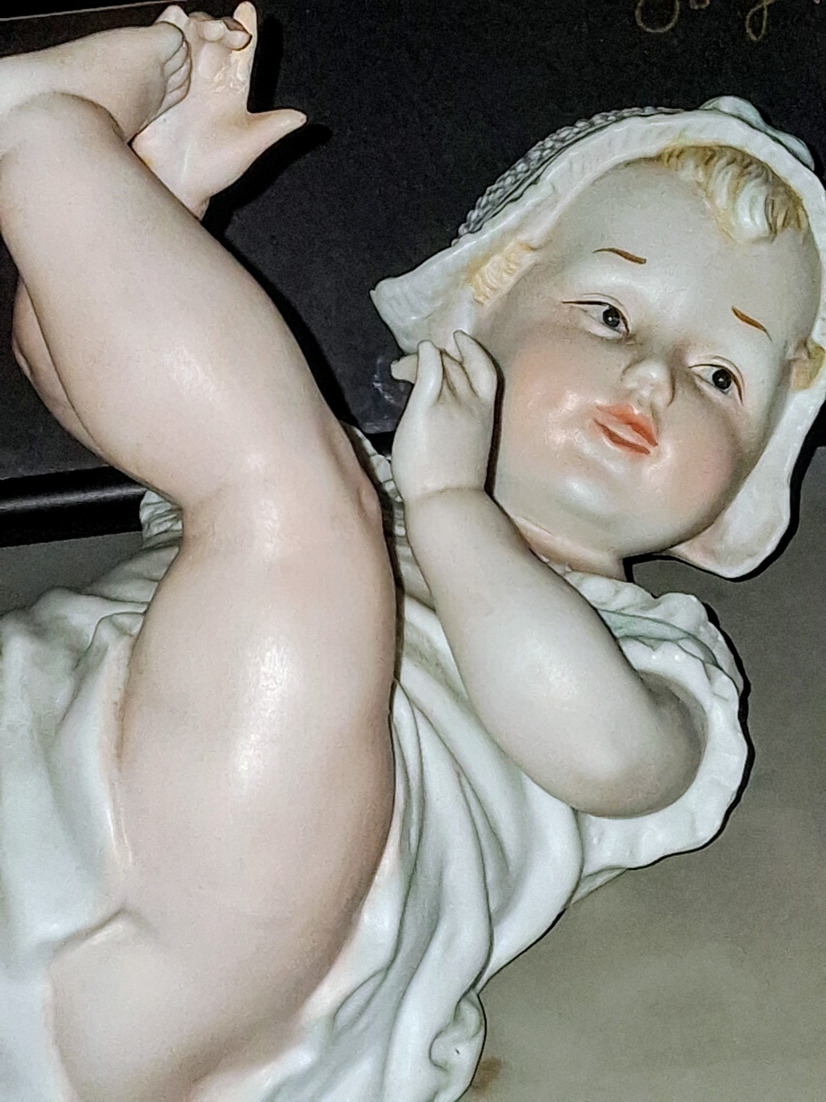 Gebruder Heubach-German Porcelain Bisque-Lying On Back Piano Baby–11″ Length