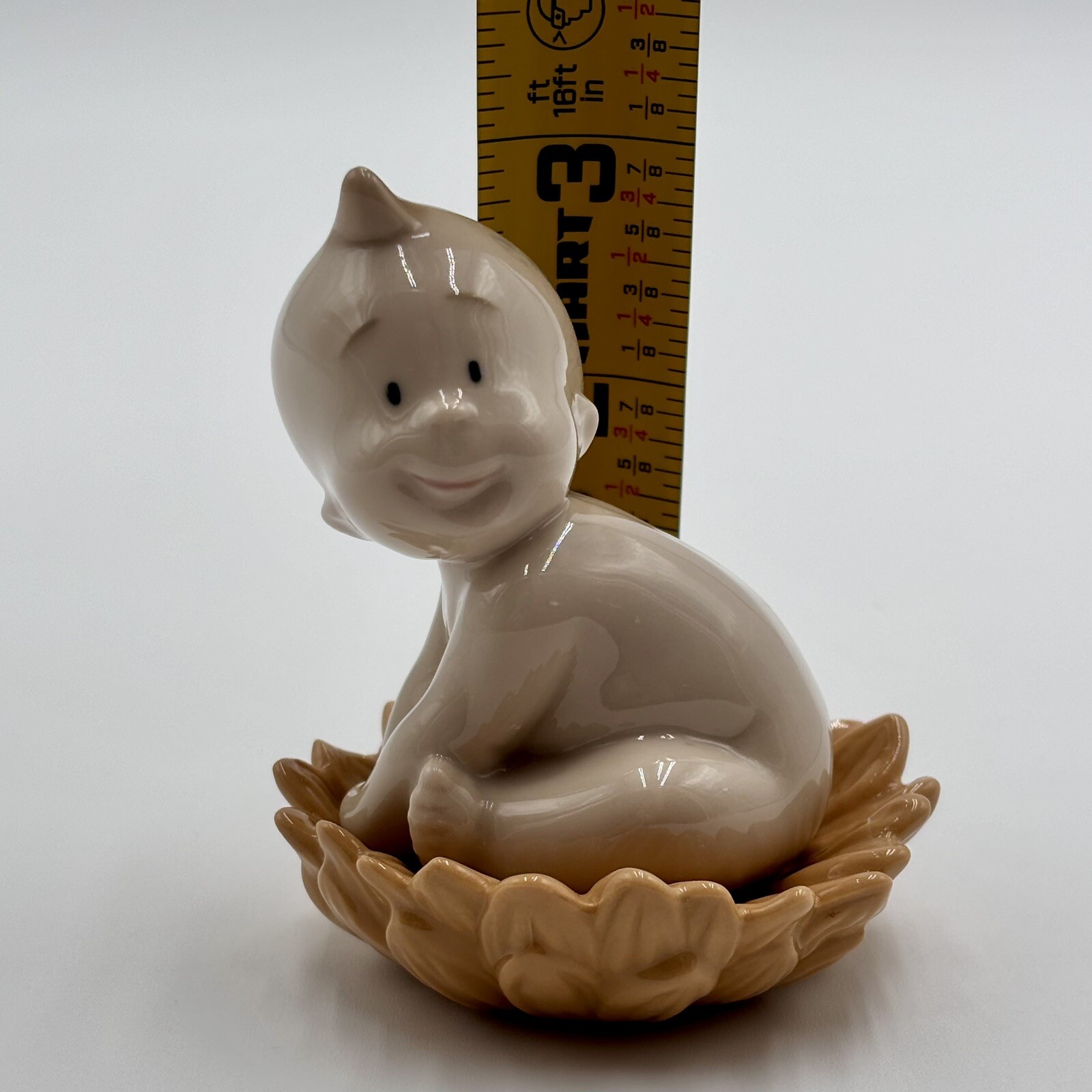 NAO By Lladro 2003 Where do babies come from…Sunflower Porcelain Baby Figurine