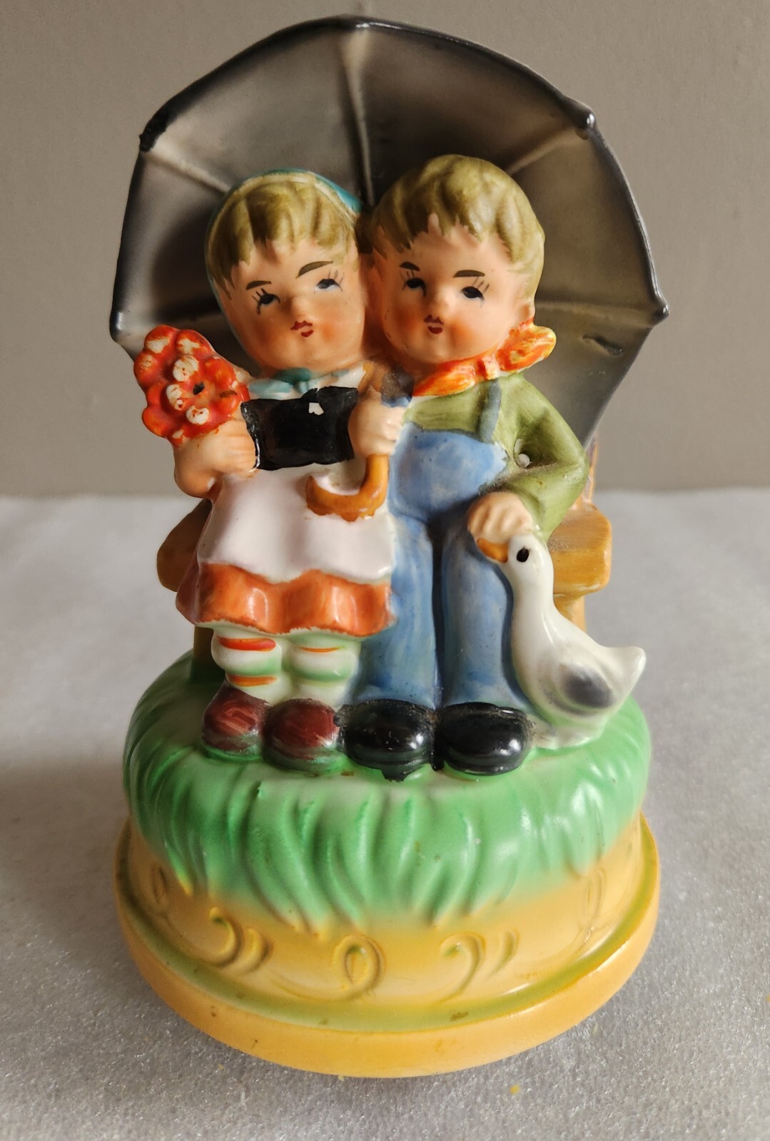 Himark Music Box Figurine • Boy and Girl on Bench Under Umbrella with Duck