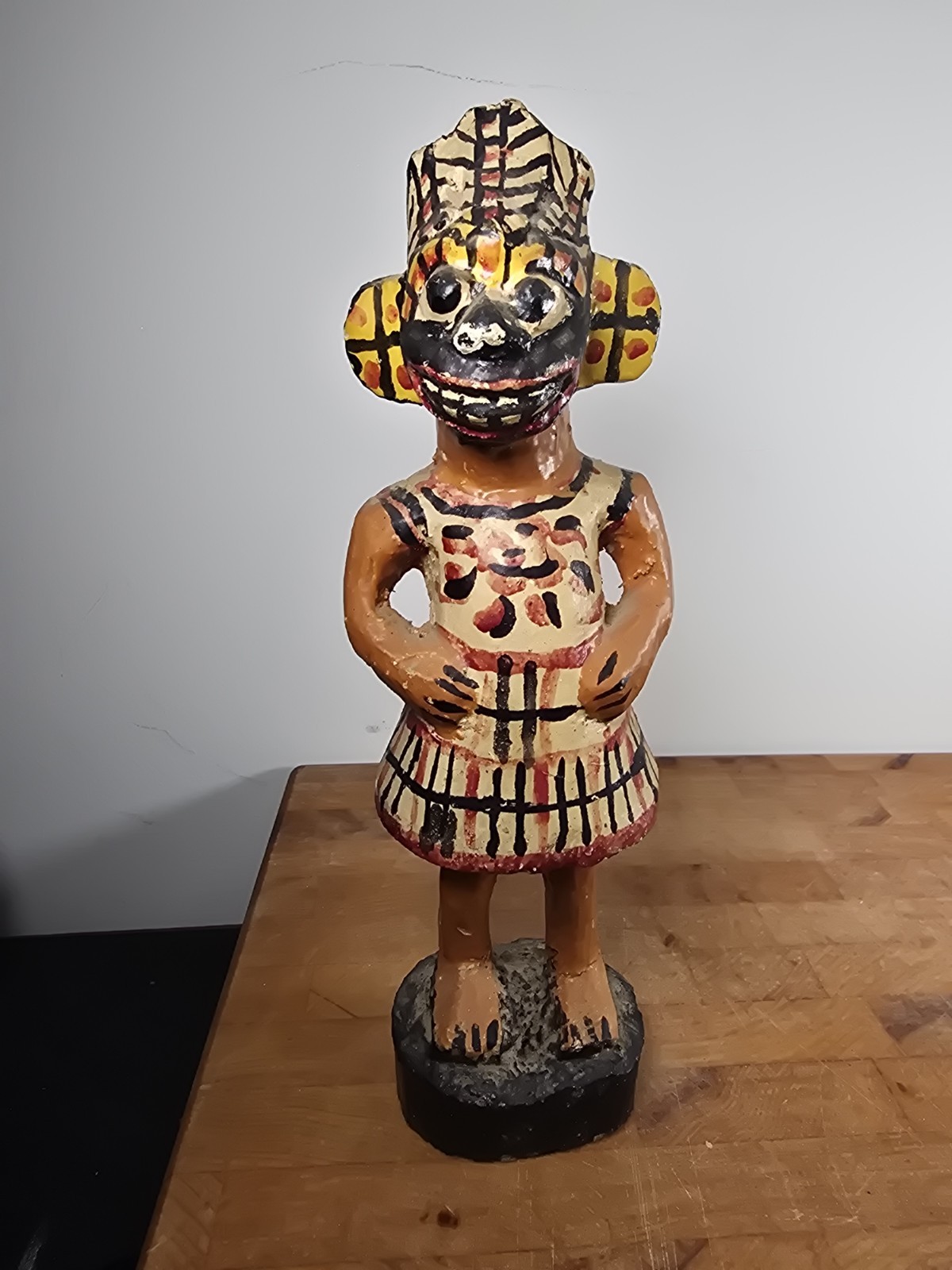 Folk art carved wood figure masked