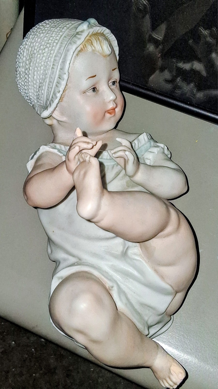 Gebruder Heubach-German Porcelain Bisque-Lying On Back Piano Baby–11″ Length