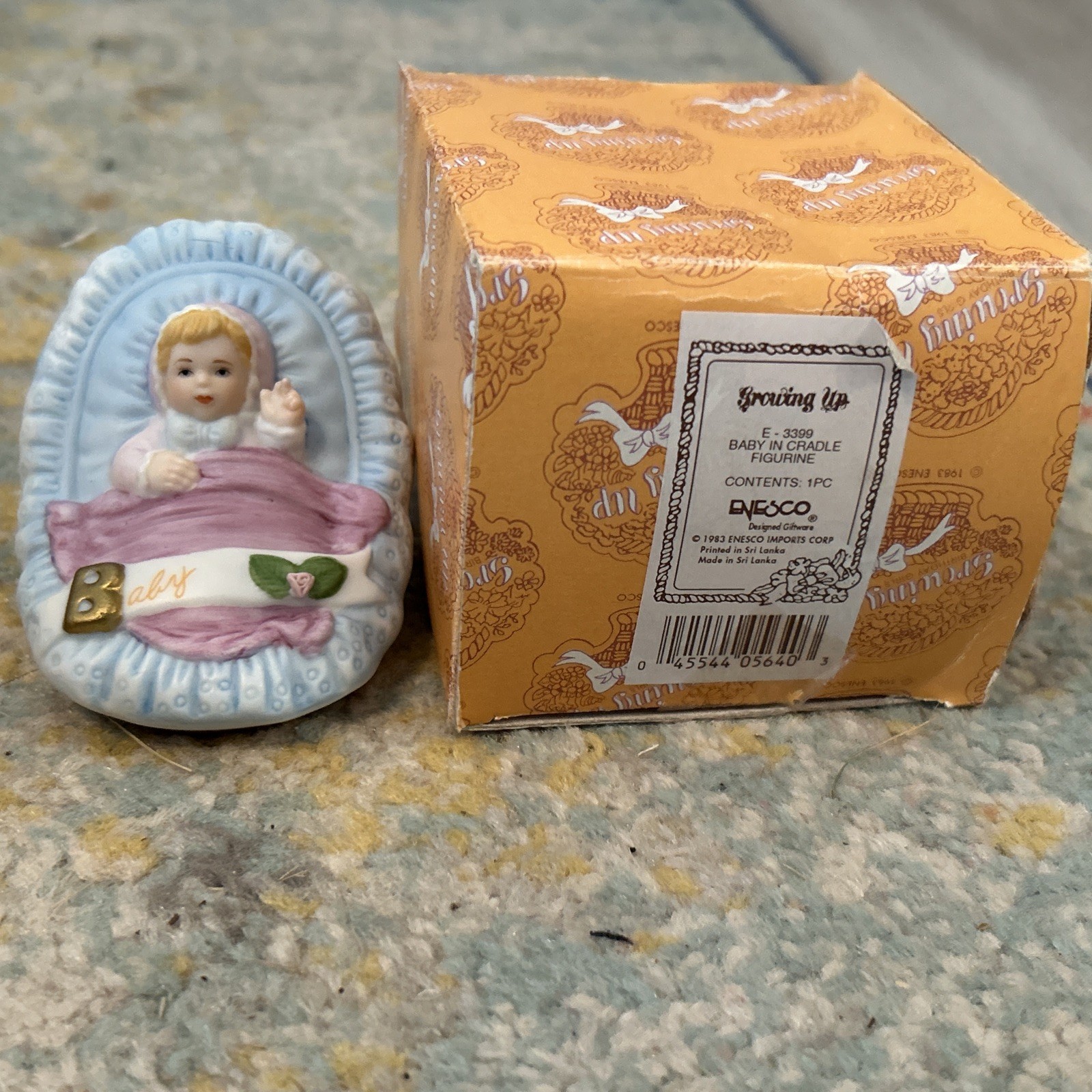 ENESCO Growing Up Baby In Cradle 1983 Porcelain Figurine Blonde Hair NIB