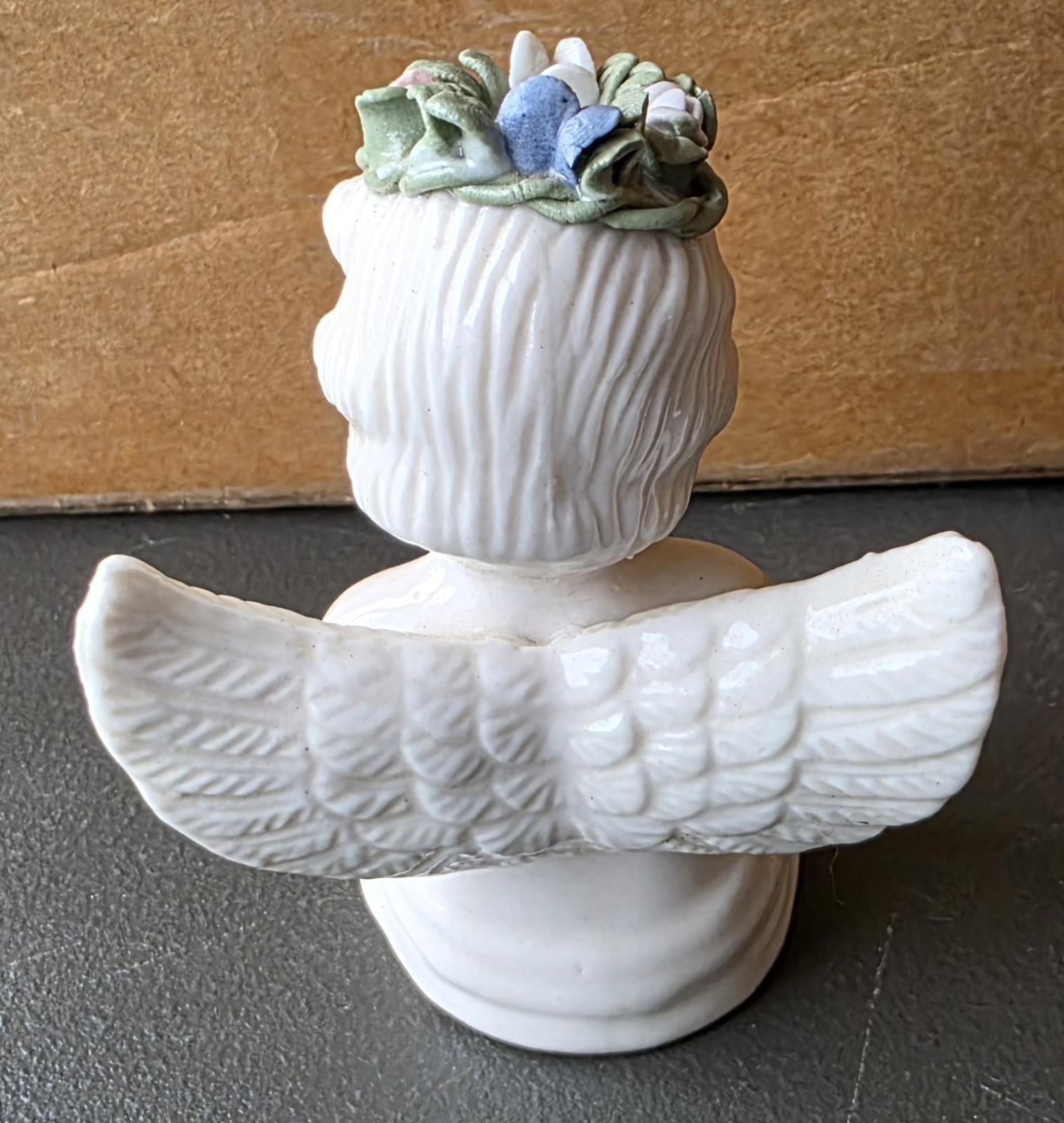 Cherub Angel with Floral Head Wreath reading Bible