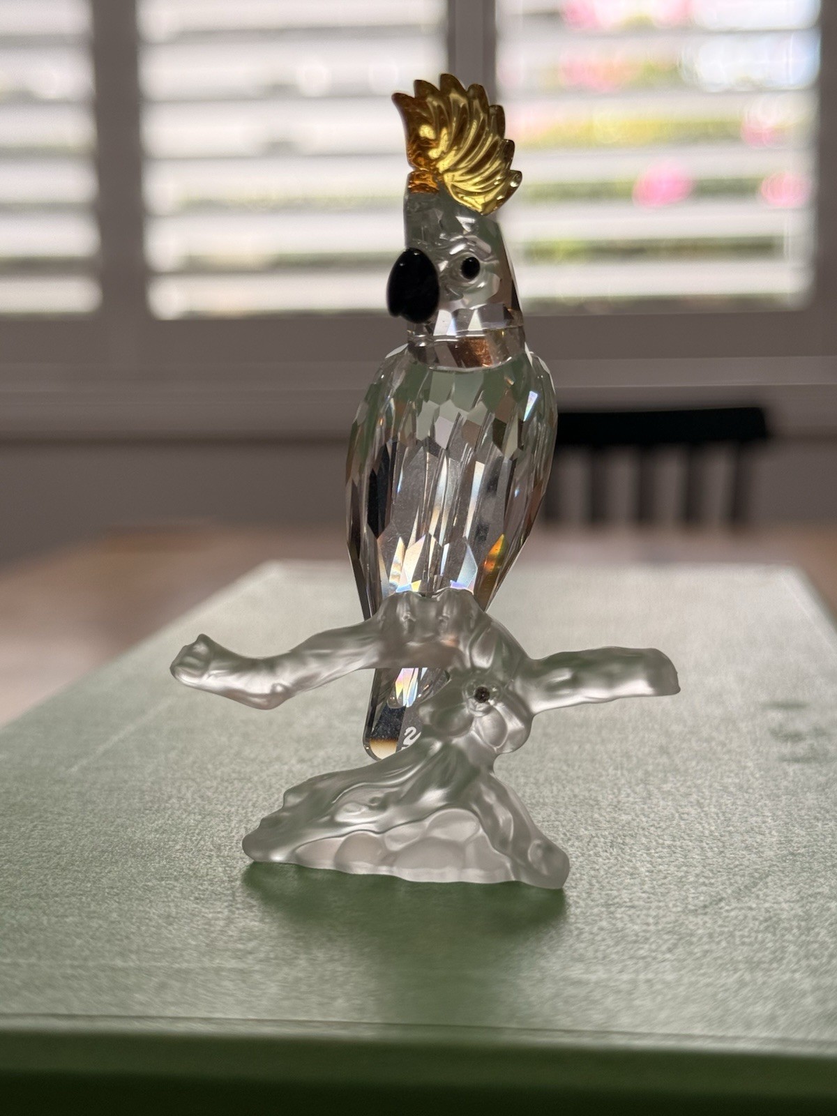 Swarovski crystal cockatoo/parrot on frosted branch. Crystal Figurine