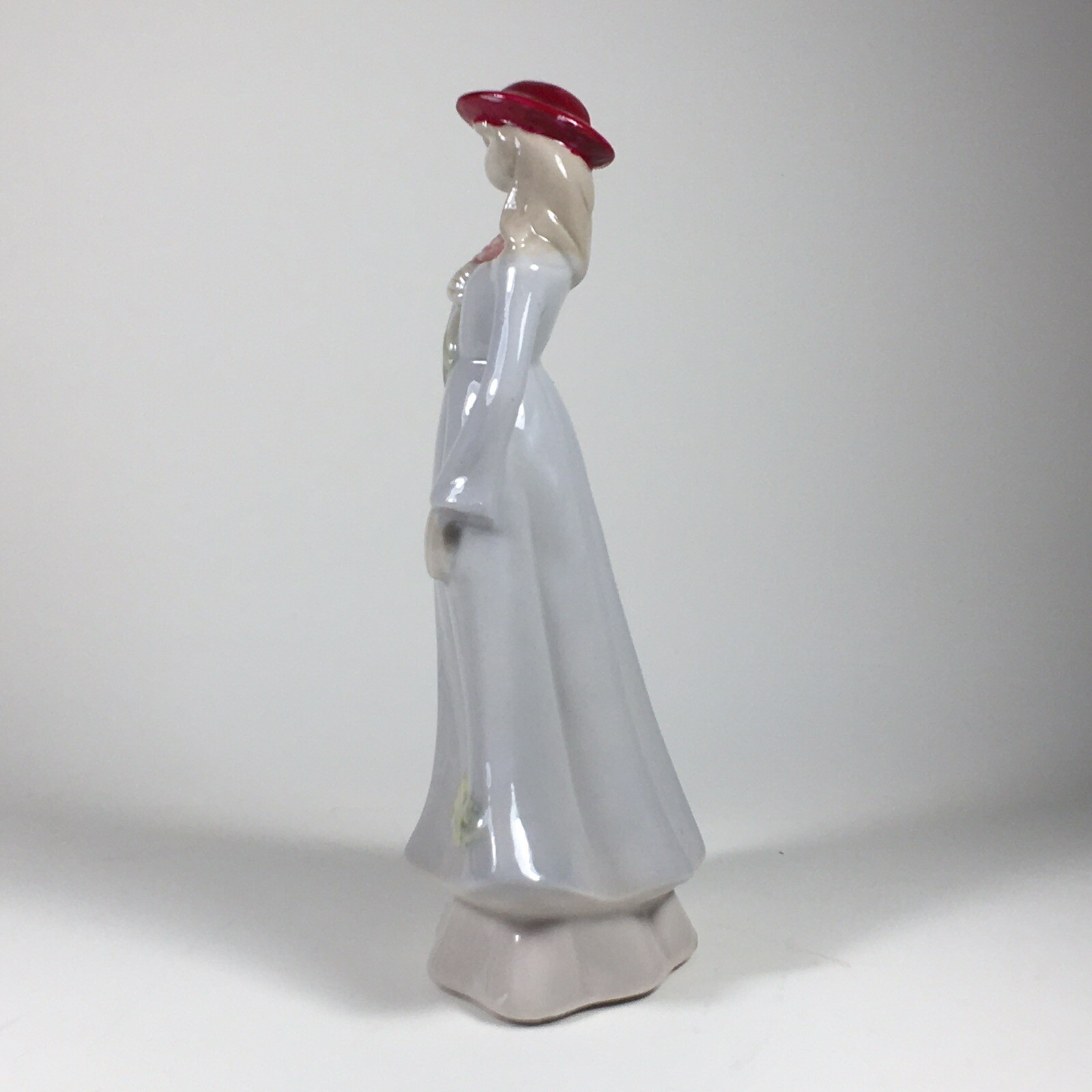 Vintage Ceramic Figurine Woman In Red Hat Holding Flowers 7″ Tall Floral Details