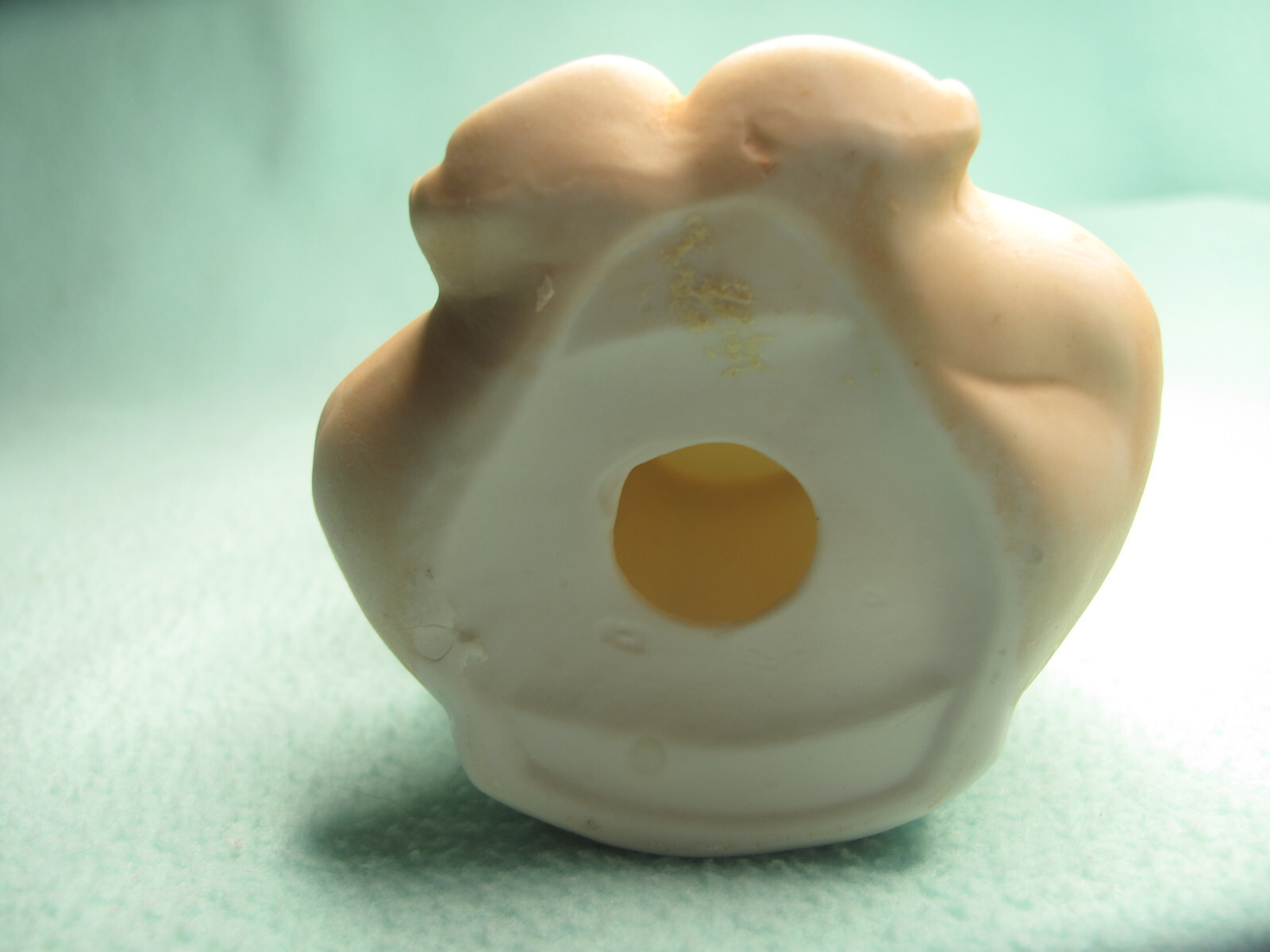A Vintage Bisque or Ceramic Kewpie Baby Powder Shaker without Plug