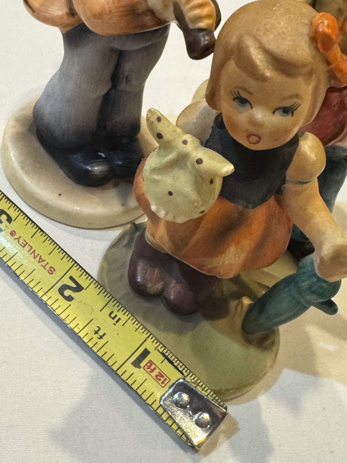 VNTG Lot of 4 Napcoware Porcelain Figurines- Bowling, Sailboat, Flute, Umbrella