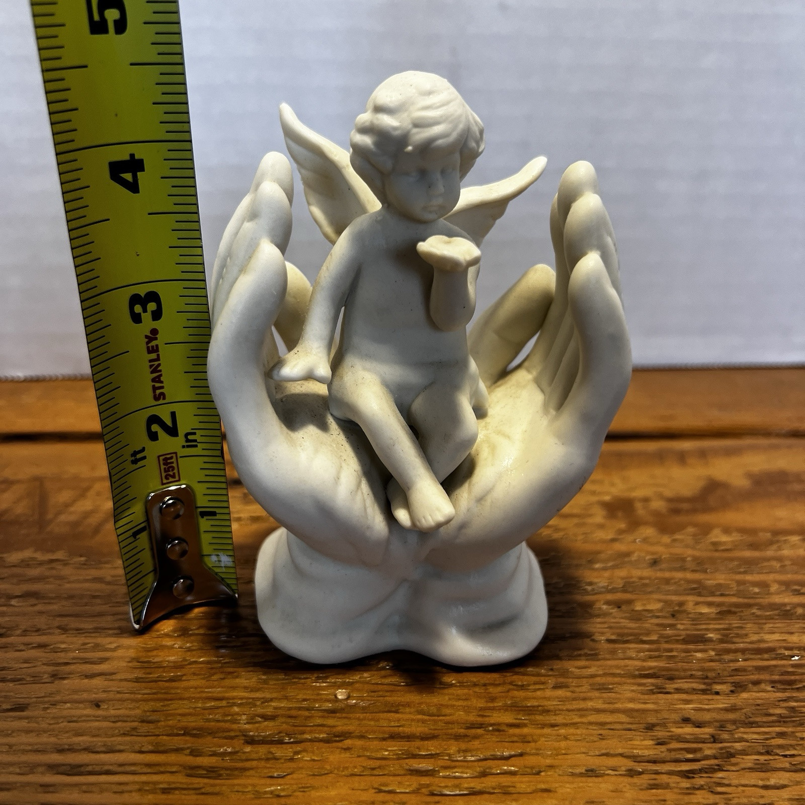 Vintage White Porcelain Figurine~Cherub Angel Sitting in Praying Hands~BEAUTIFUL