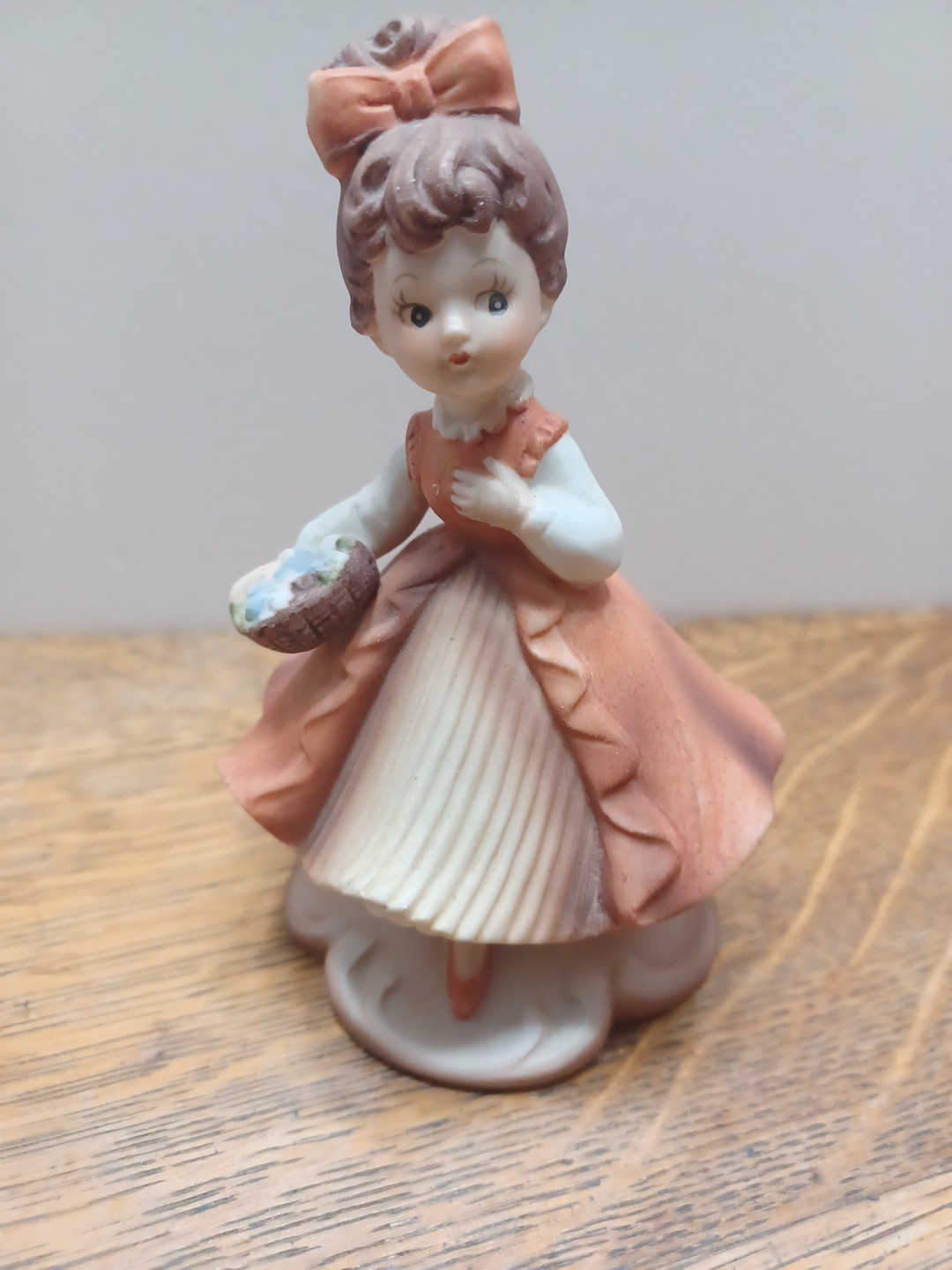 Napcoware Girl With Rust Colored Dress Holding Basket Of Flowers Repaired, Read