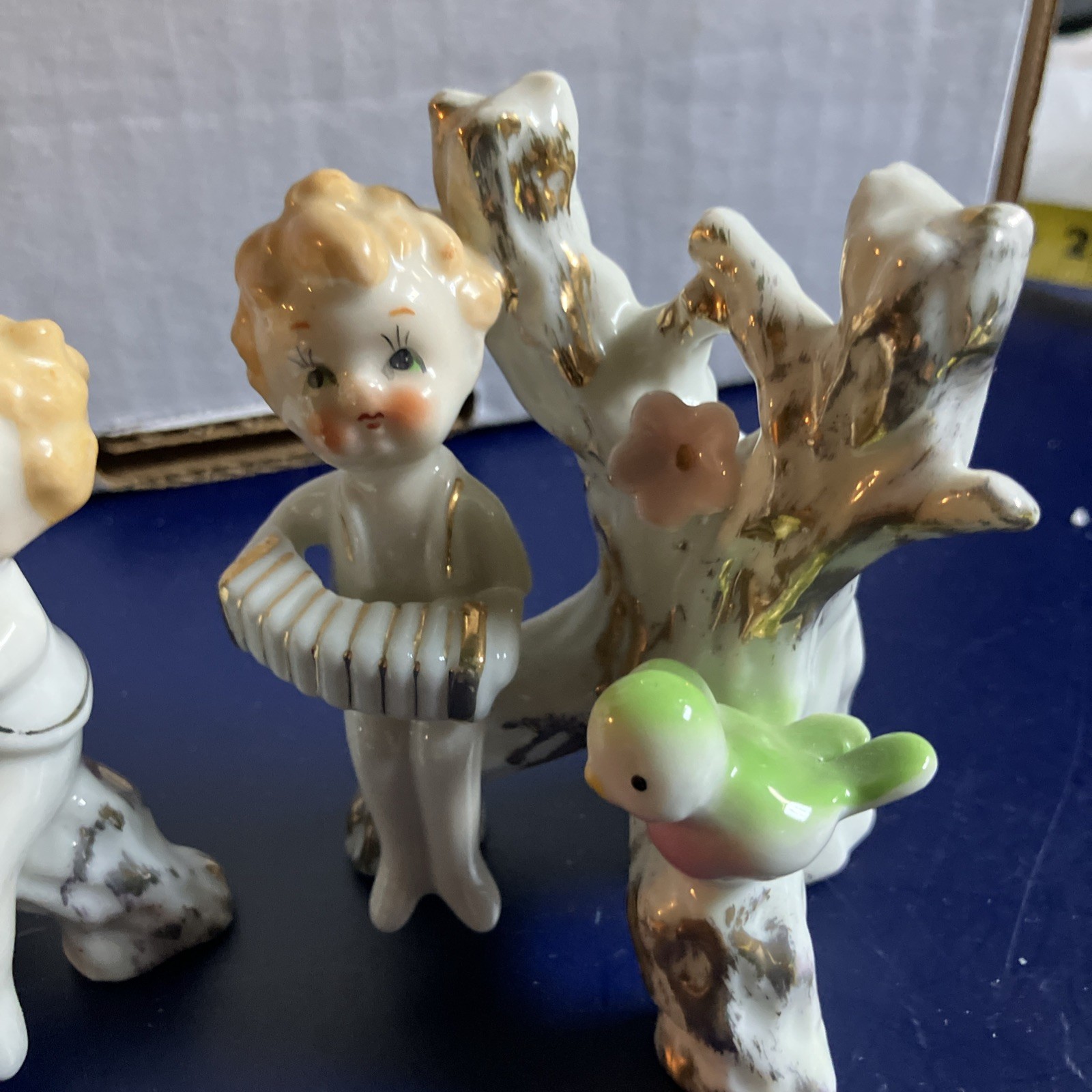 Two Vintage Cherubs Playing Instruments