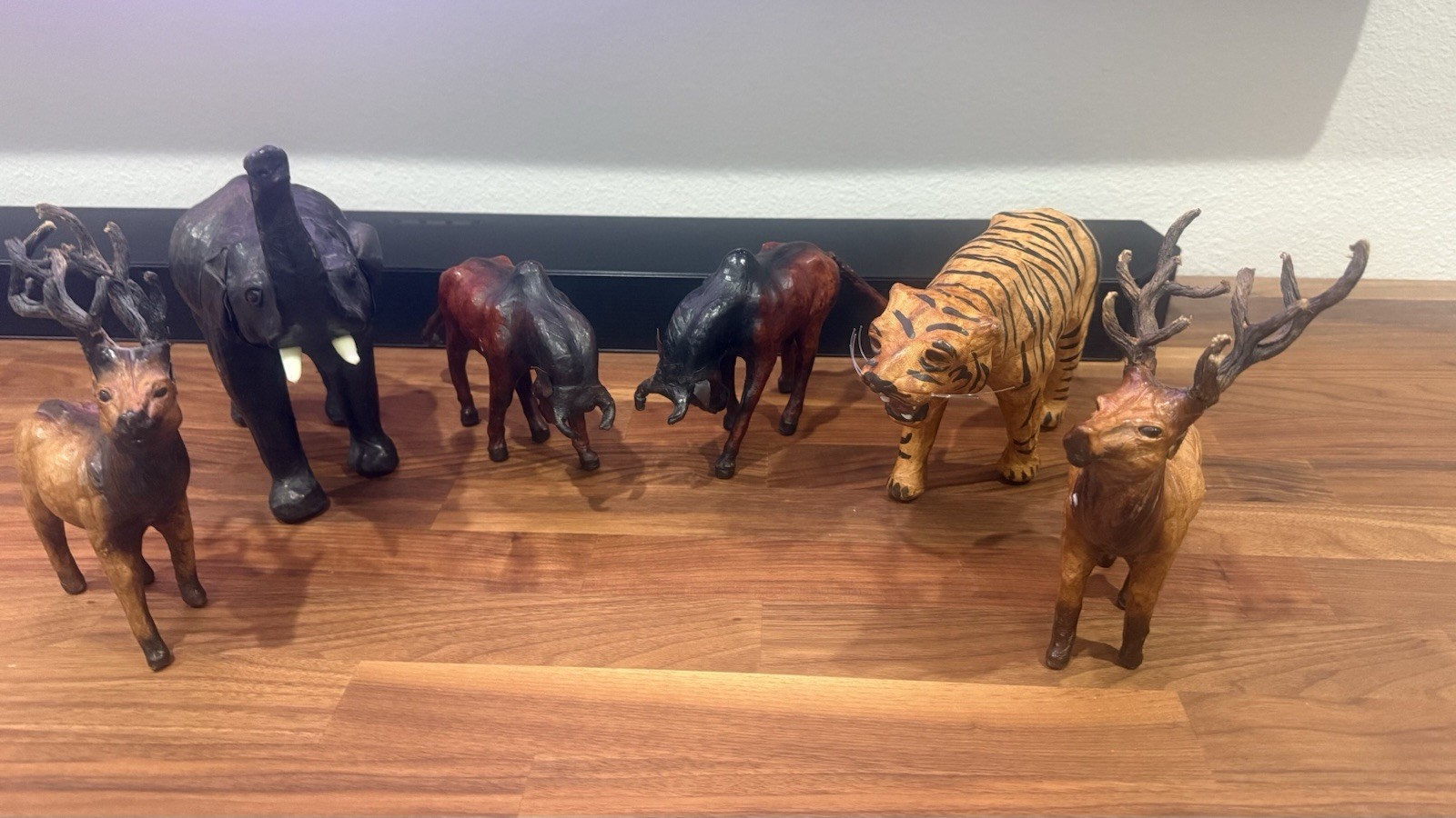 A collection of Six leather wrapped clad animals.
