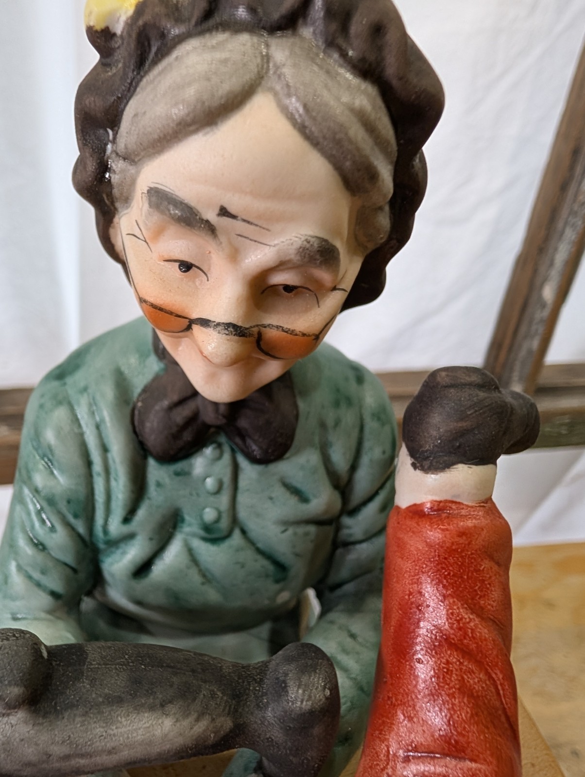 CERAMIC GRANDMA SEWING YOUNG BOY’S PANTS