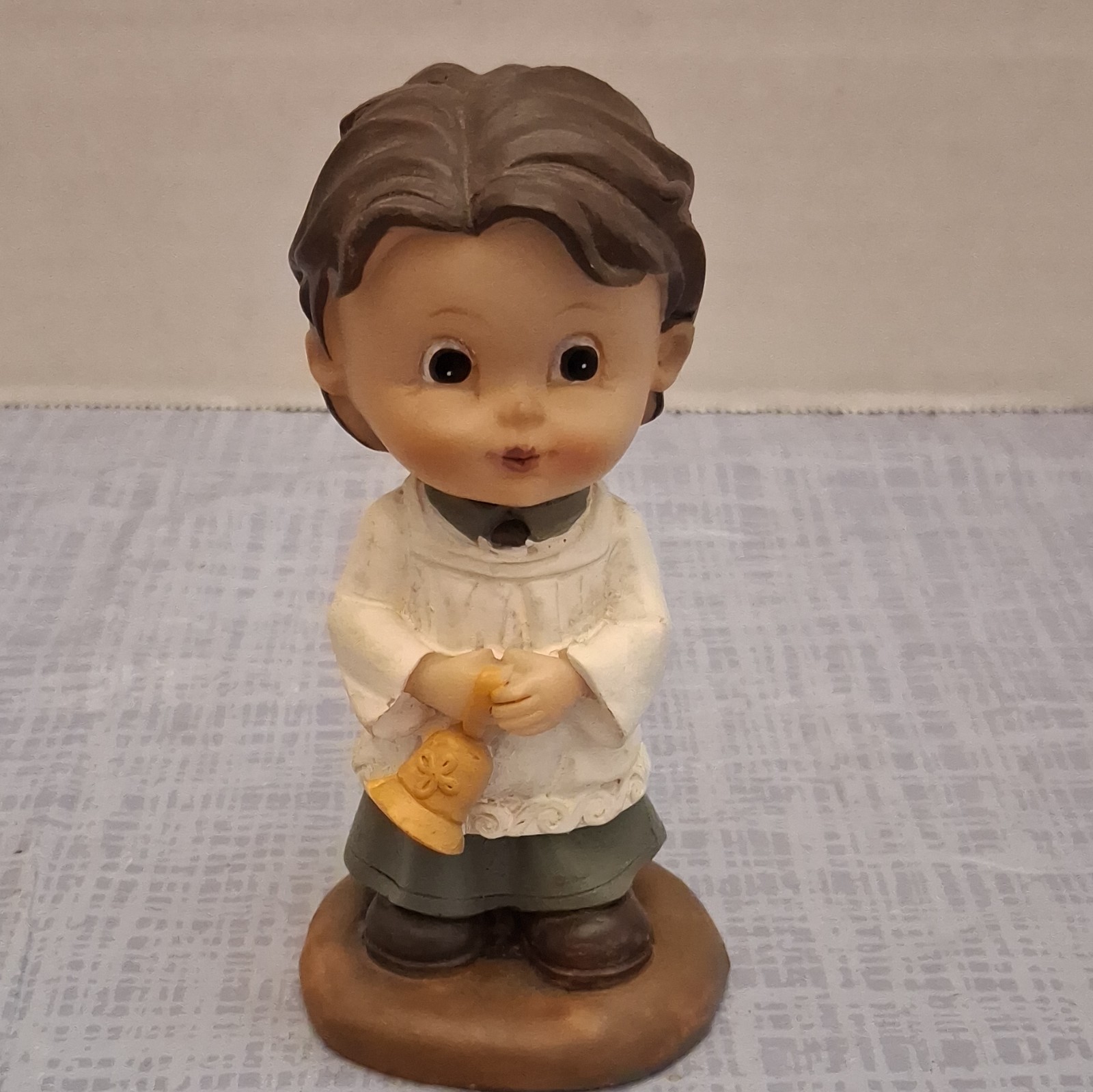 Painted Resin Boy Figurine Holding Bell White Green Yellow Brown 4 in