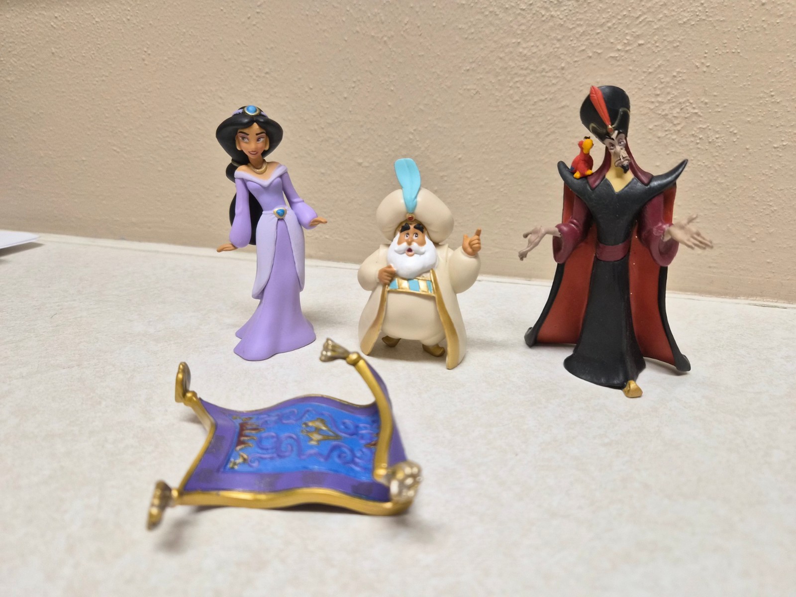 Figurines from Aladdin, Princess Jasmine, Jafar, The Sultan, and Magic Carpet