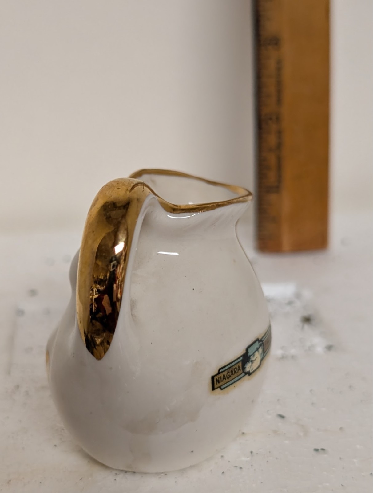 Vintage 2.5in gold trim 1946 porcelain happy smile face mini teapot cup