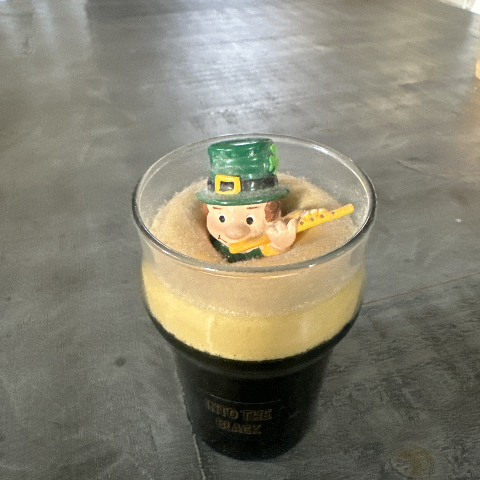 Green Hat Leprechaun Playing Flute Inside Miniature Glass “Into The Black”