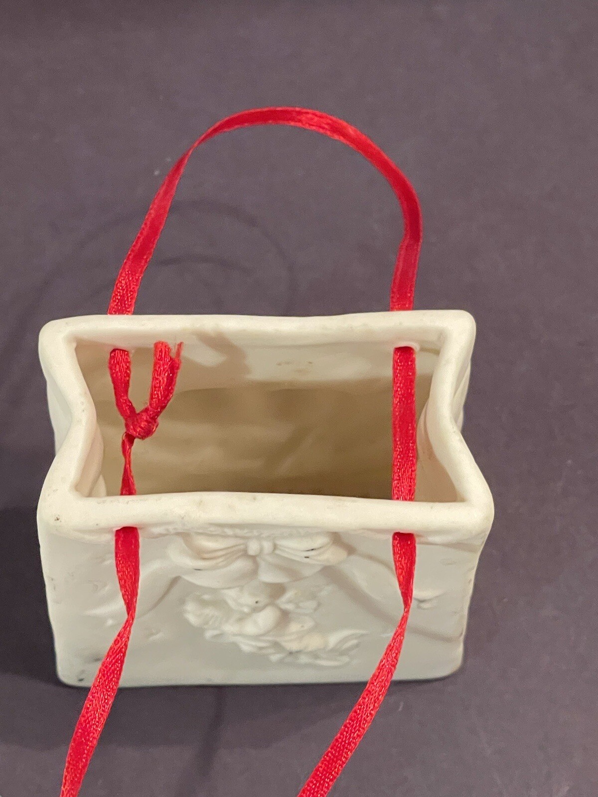 Autom China White Porcelain Cherub Bag With Red Ribbon Handle
