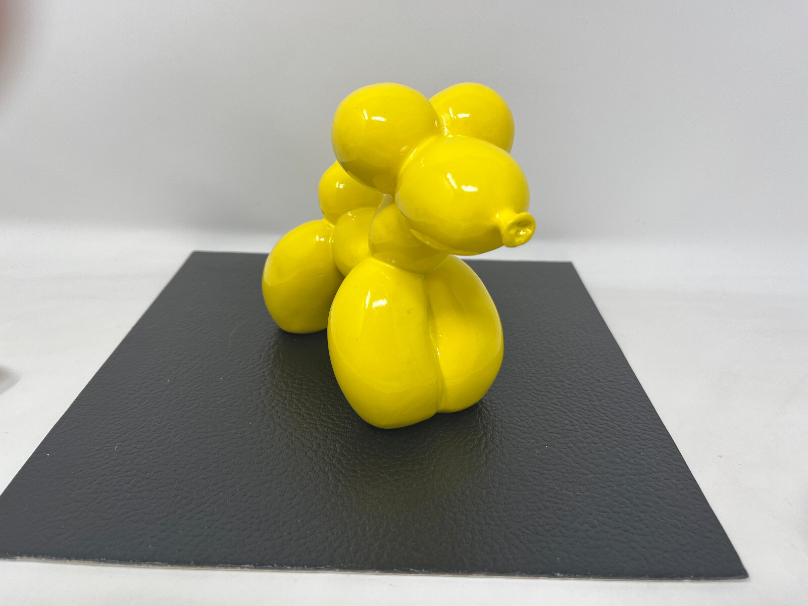 YELLOW CERAMIC RESIN BALLOON DOG FIGURINE- 4.5″ x 6″
