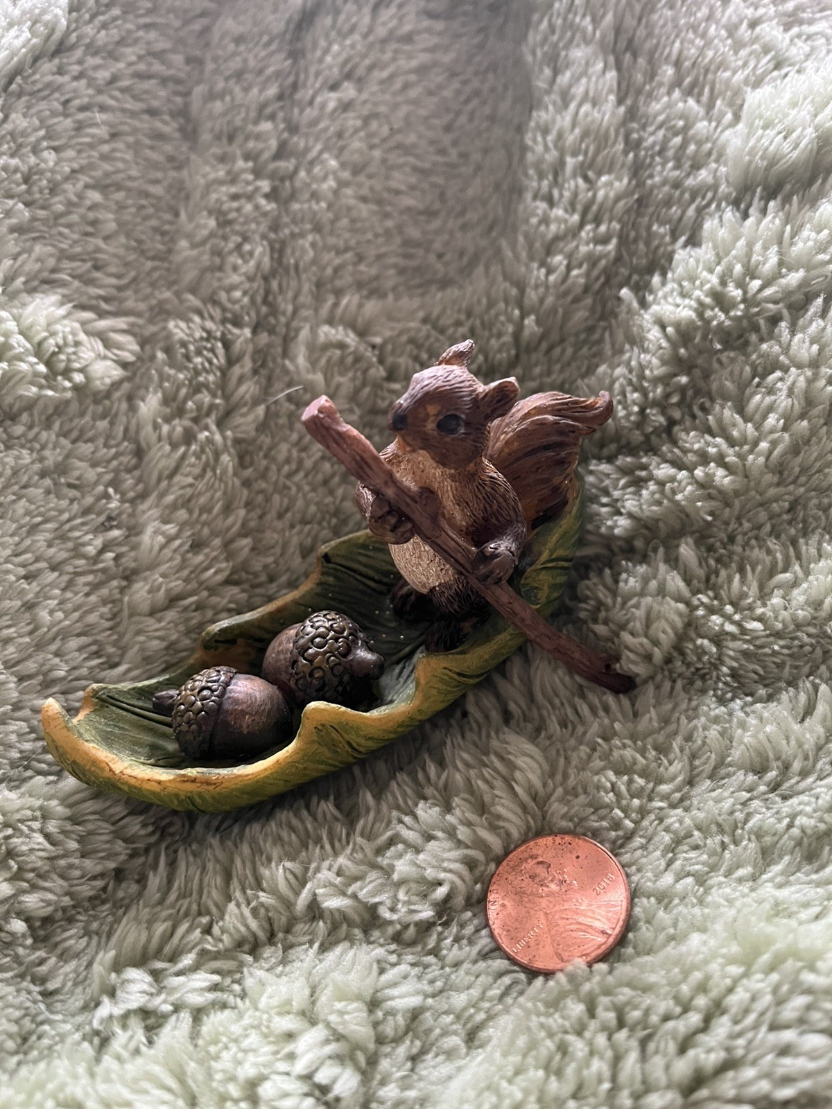 Adorable Whimsical Squirrel Rowing A Leaf Boat Figurine