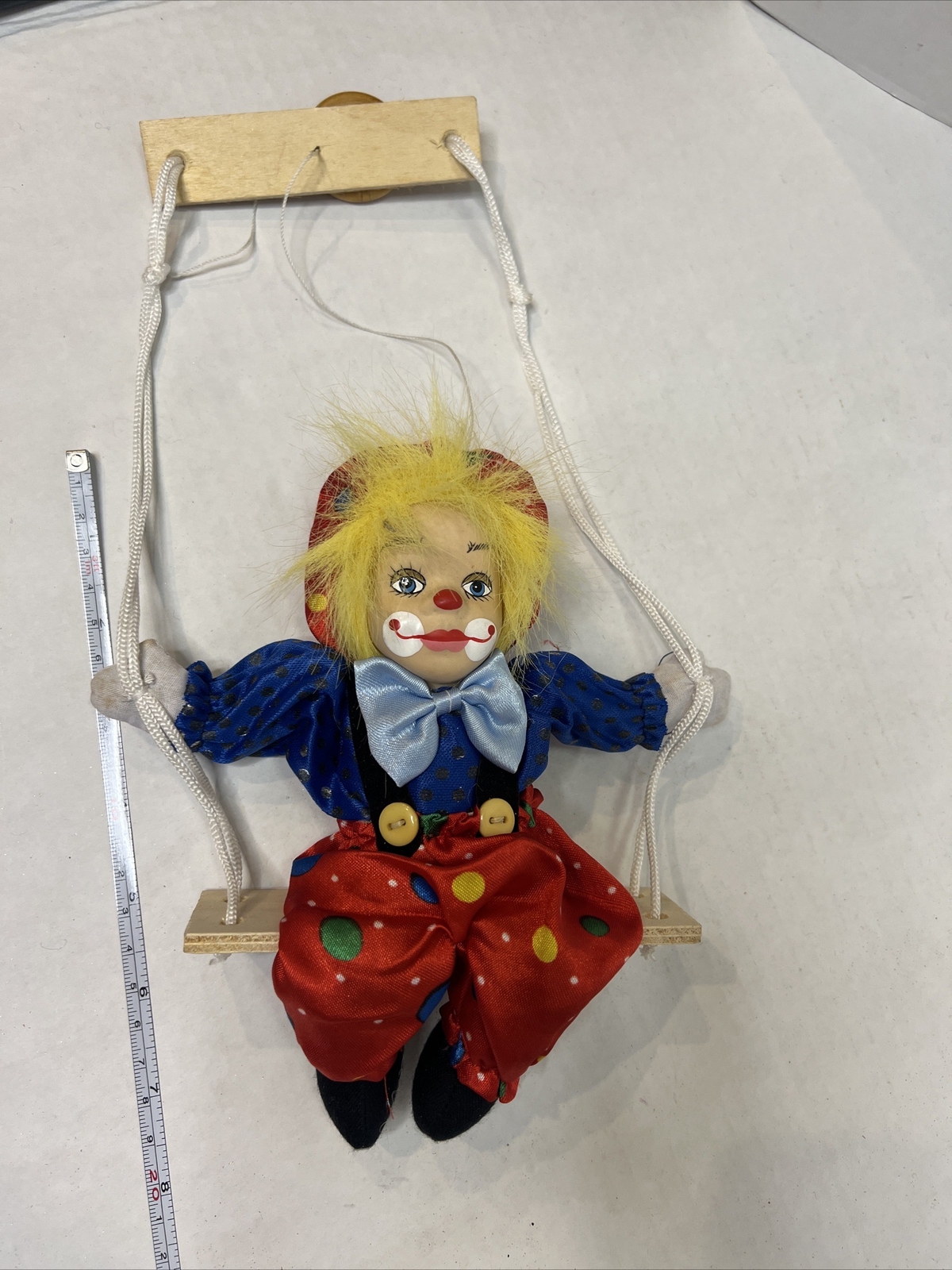 Clown Doll On A Swing Porcelain Face, Yellow Hair, Bright, Happy, Colorful!
