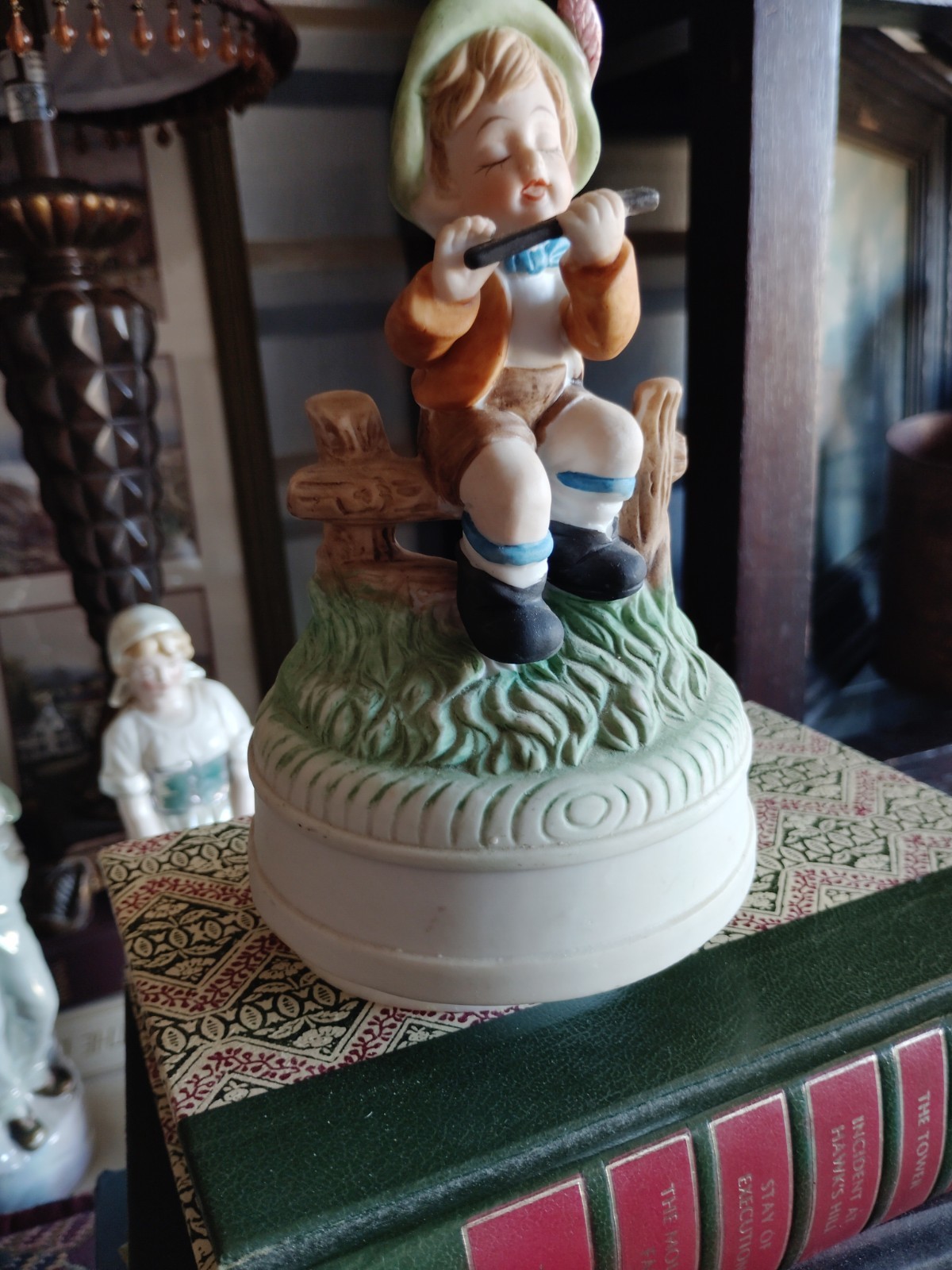 Ceramic Boy Musician Figurine Playing Harmonica on Round Base, Multicolor