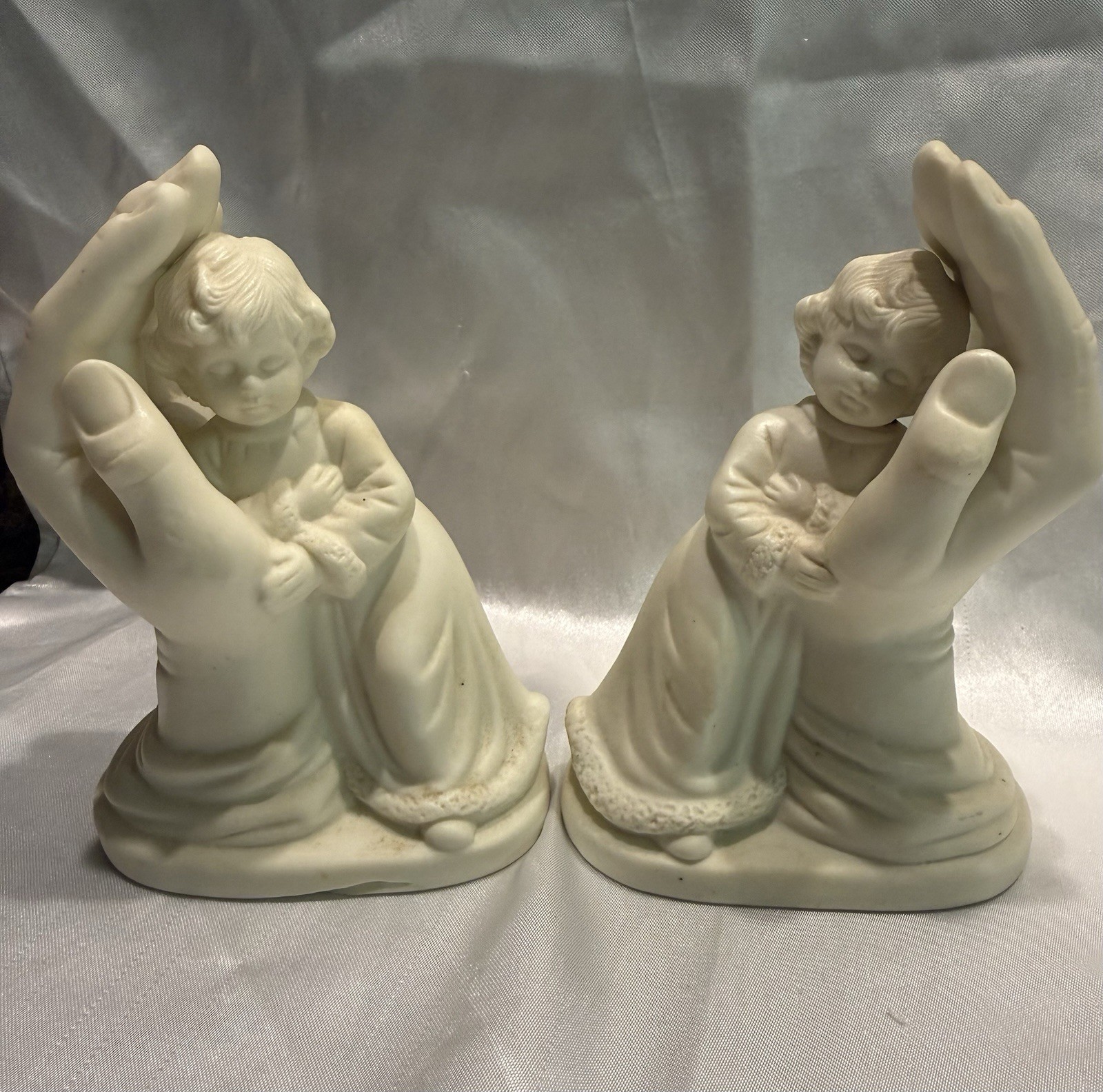 White Ceramic Angel Figurines Pair Praying Hands Holding Child 3D Effect