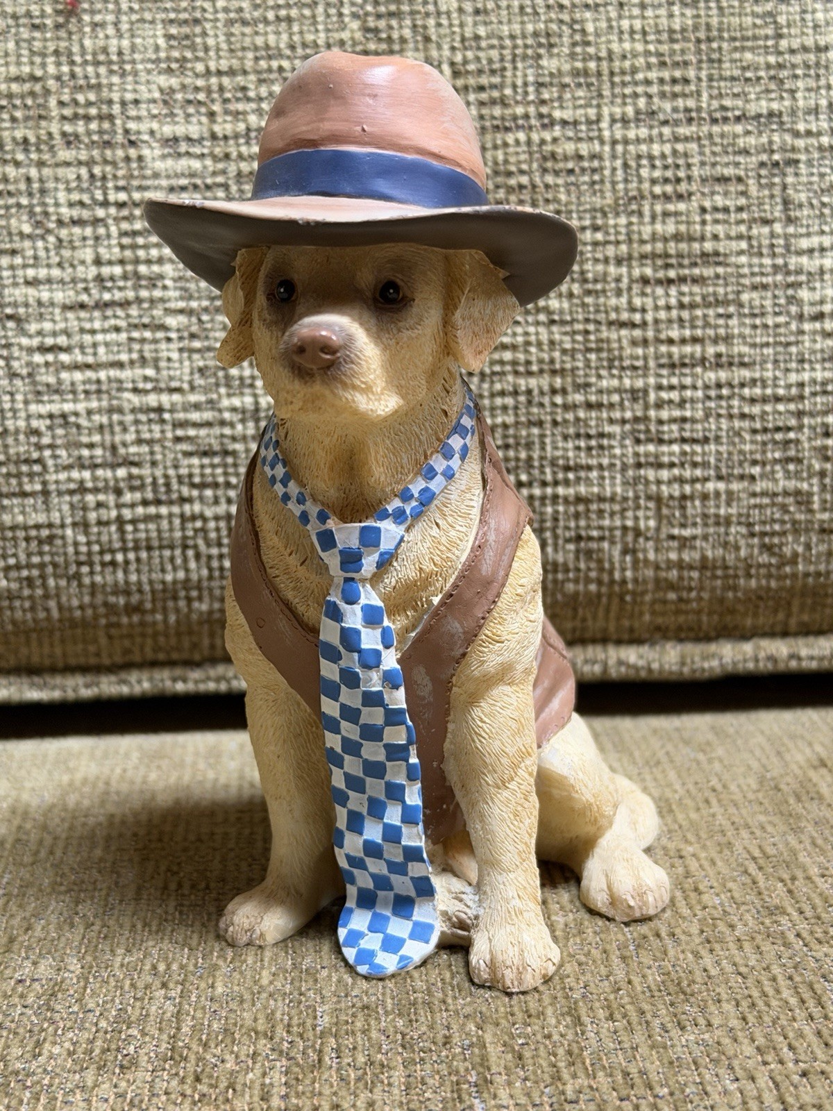 lifelike dog figurine in clothes
