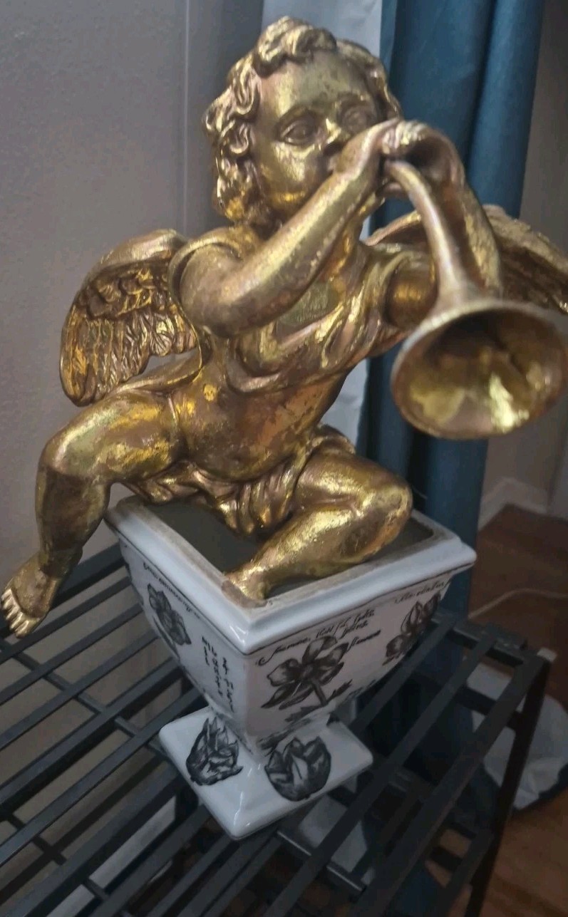 Golden Cherub With Horn
