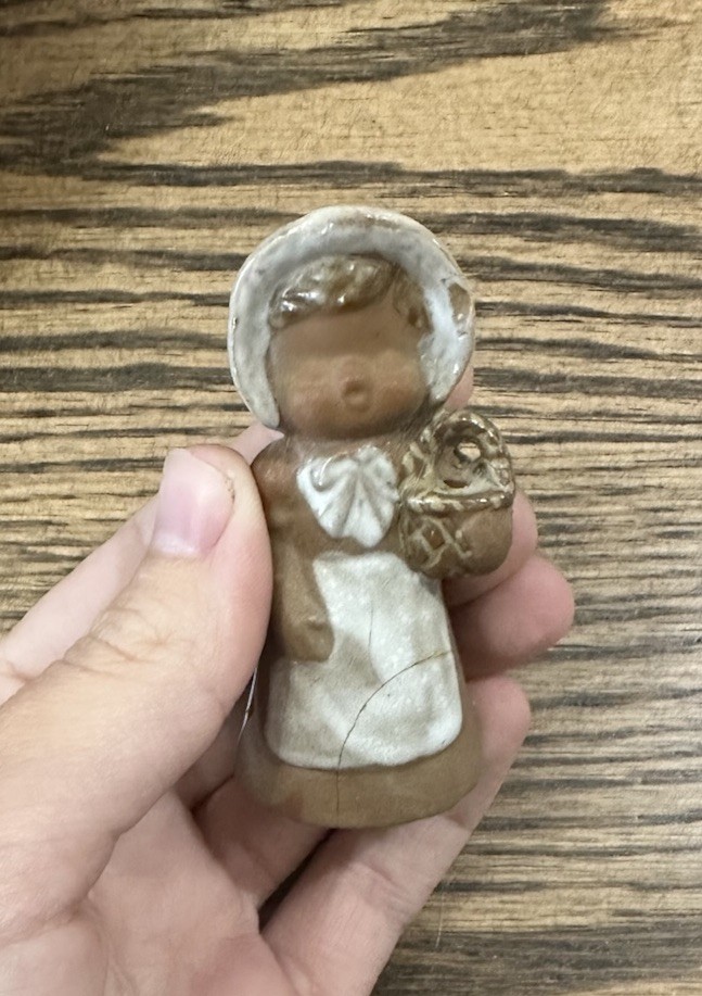 Small brown clay Resin Girl Figurine, Brown Dress & White Bonnet early 1900s