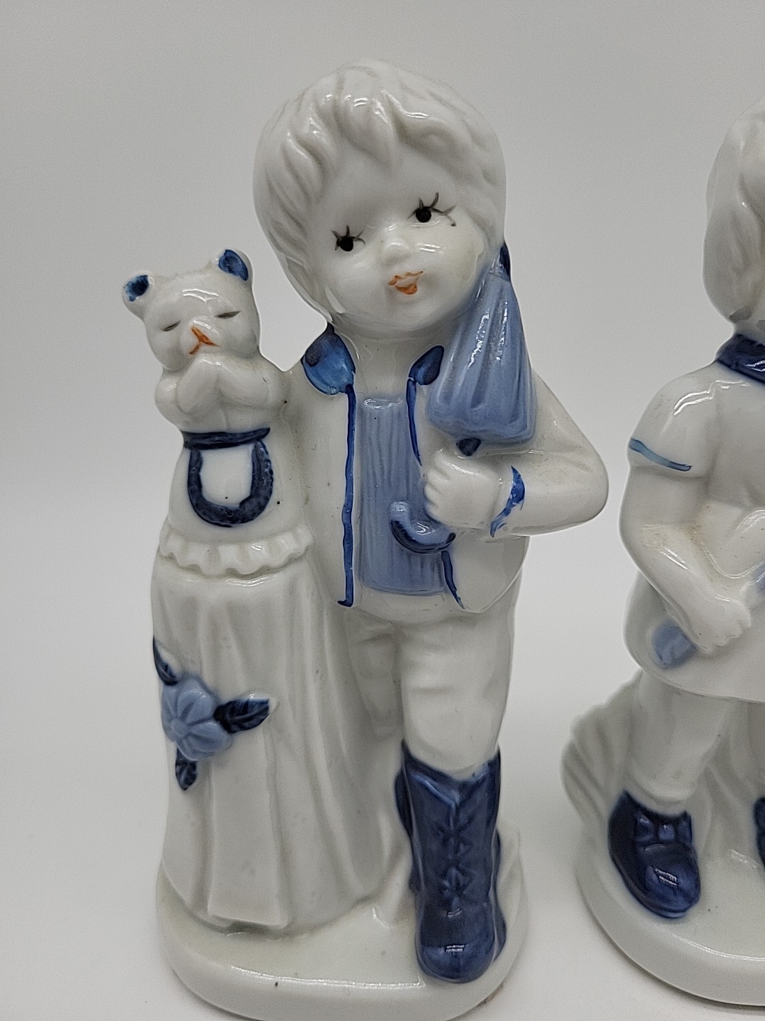 Vtg Delft Blue Dutch Girl Boy Child Showing Cat Bear Holland Porcelain Figurines