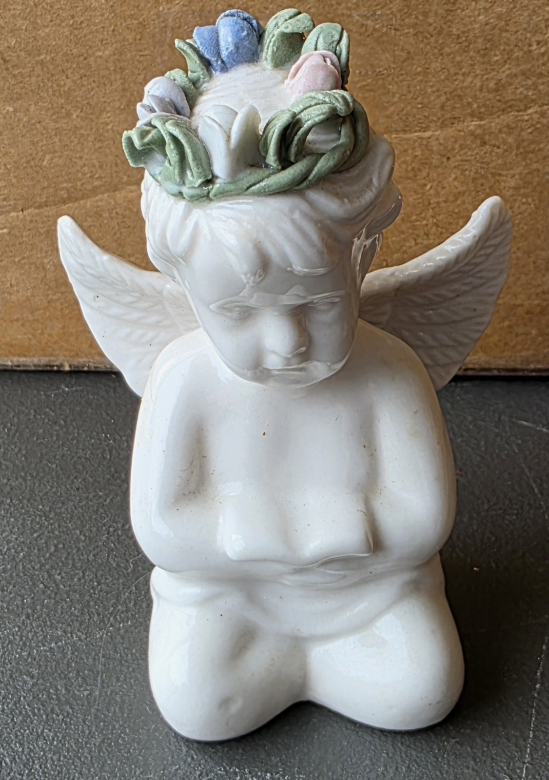 Cherub Angel with Floral Head Wreath reading Bible