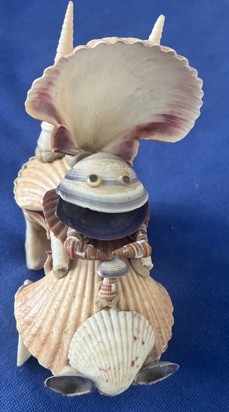 Vintage Handcrafted Figurine Riding a Vehicle made out of Seashells