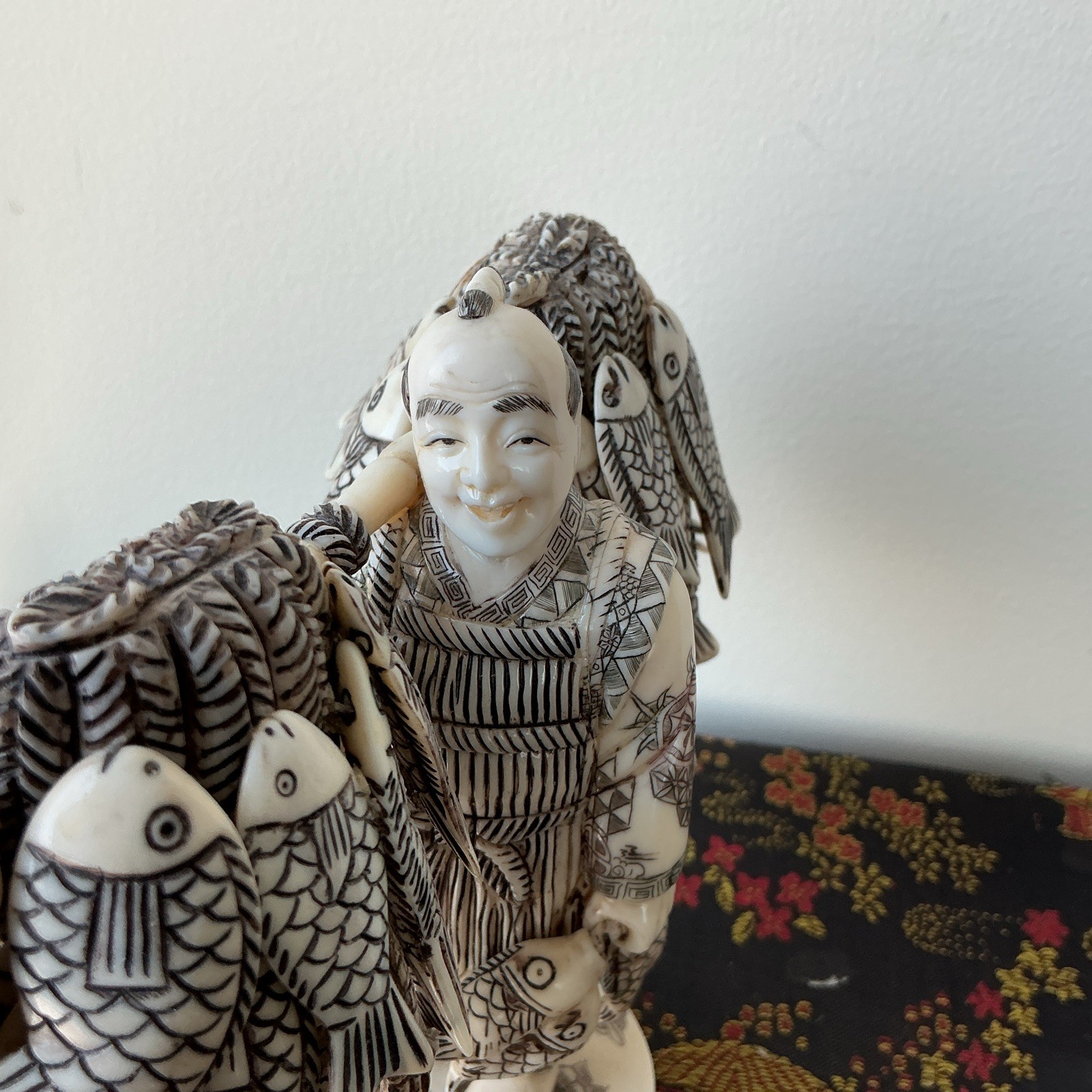 Hand Carved Ivory color Fisherman Figurine Carrying Fish Pole Ivory Black 6 in