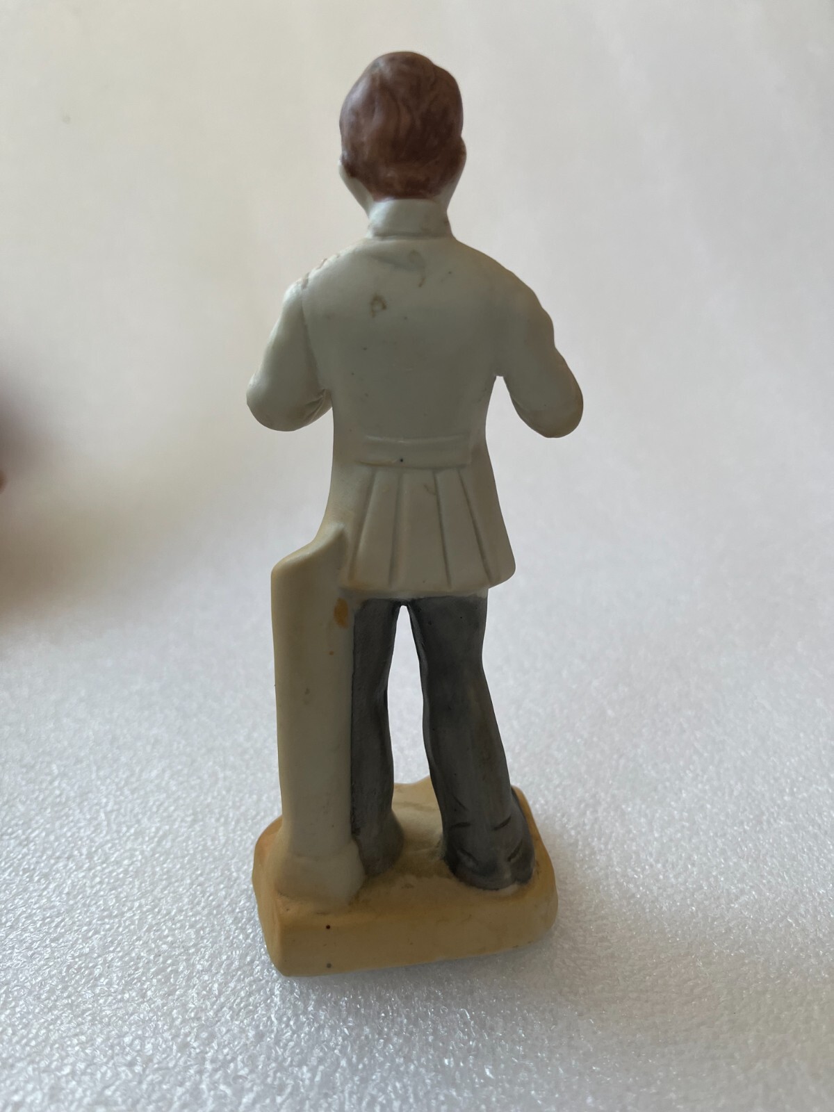Vintage Porcelain Dentist Figurine Holding extracted tooth