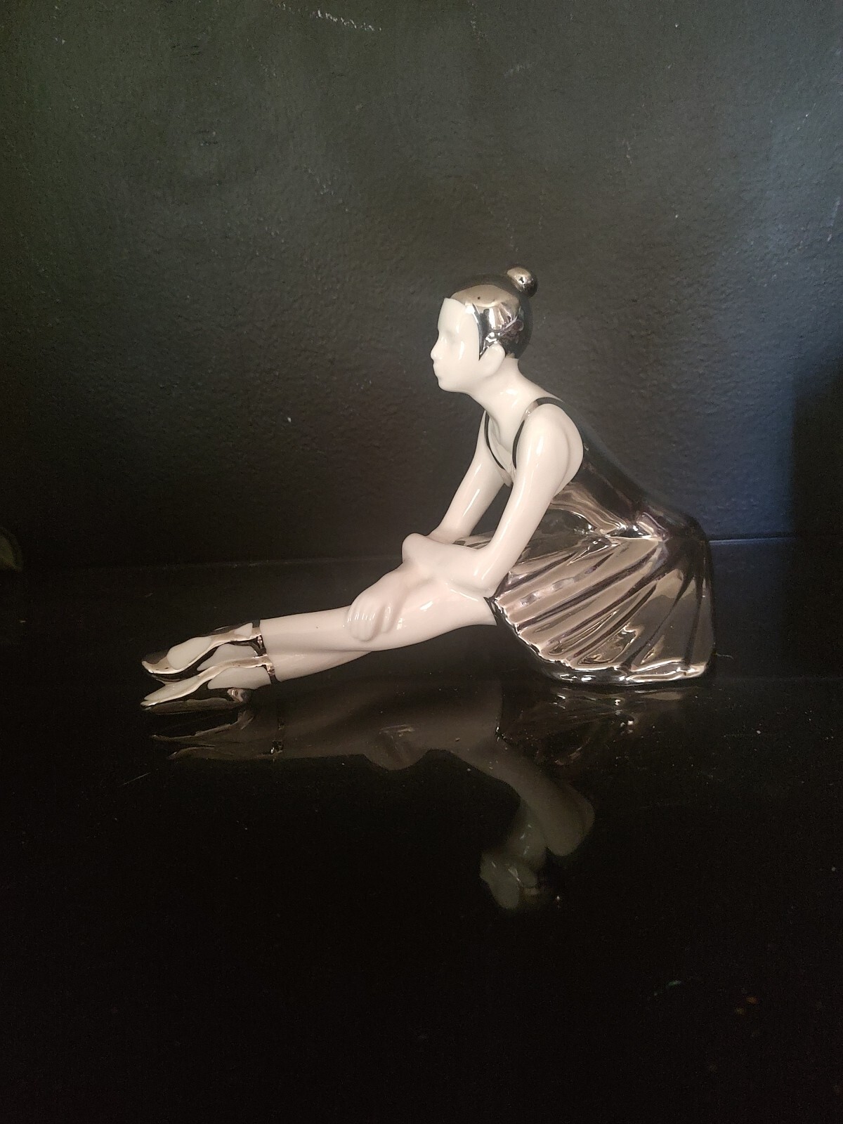 WHITE AND SILVER PORCELAIN SITTING BALLERINA FIGURINE. 9″L x 6″H X 5″W
