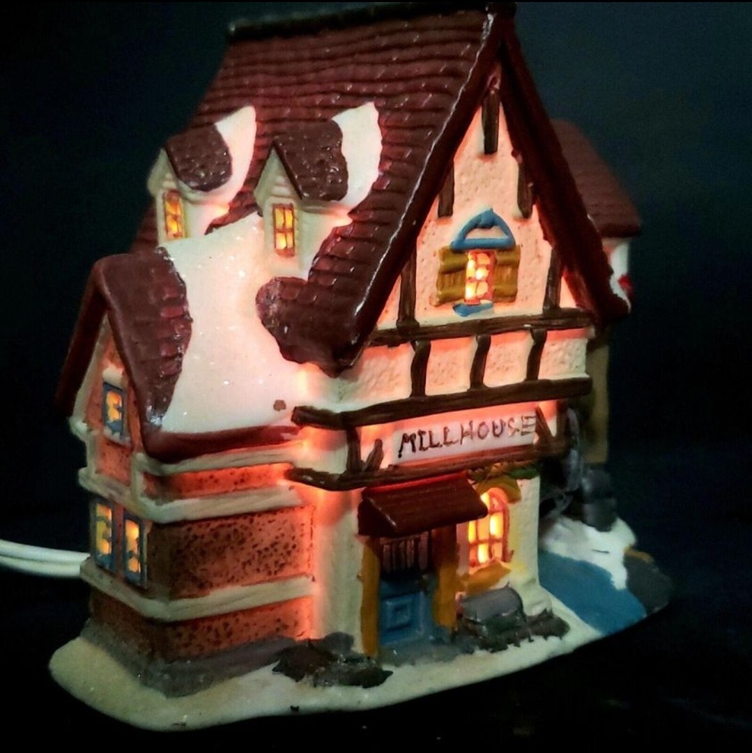 Charming Handcrafted Millhouse Figurine with Snow-Capped Roof and Flowing Water.