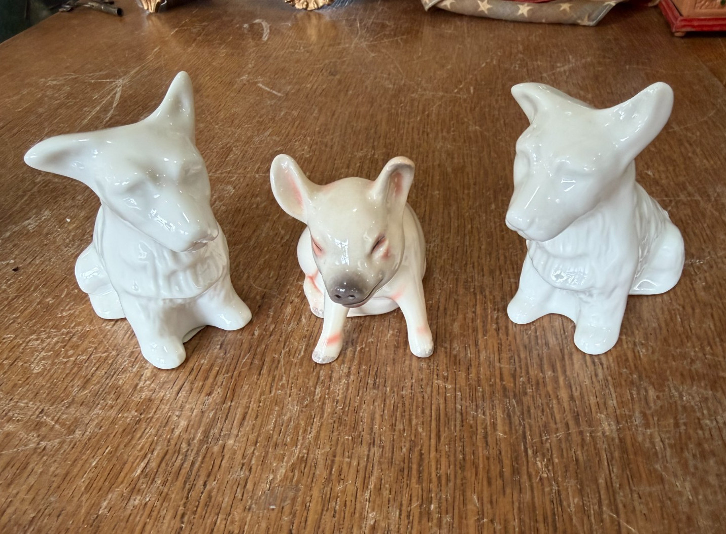 Pair of Belleek Terrier Dog Figurines with a Goebel Pig Figurine