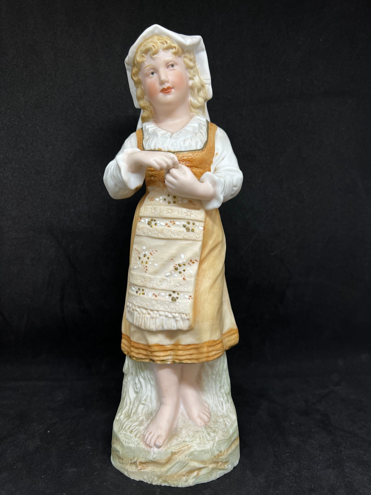 Gebruder Heubach-German Bisque-A Young Barefoot Woman Holding A Apple 10″