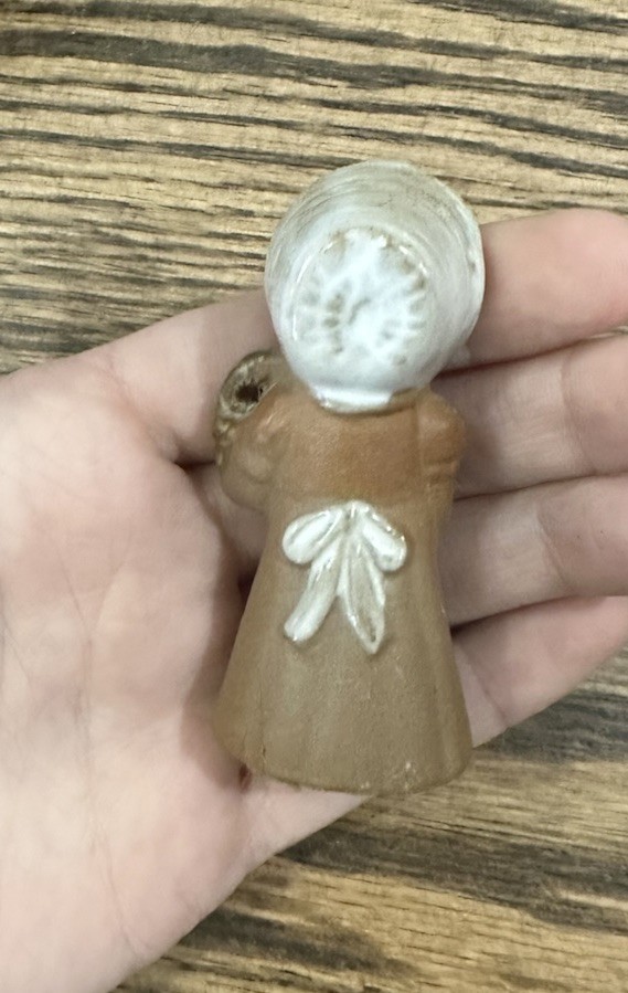 Small brown clay Resin Girl Figurine, Brown Dress & White Bonnet early 1900s